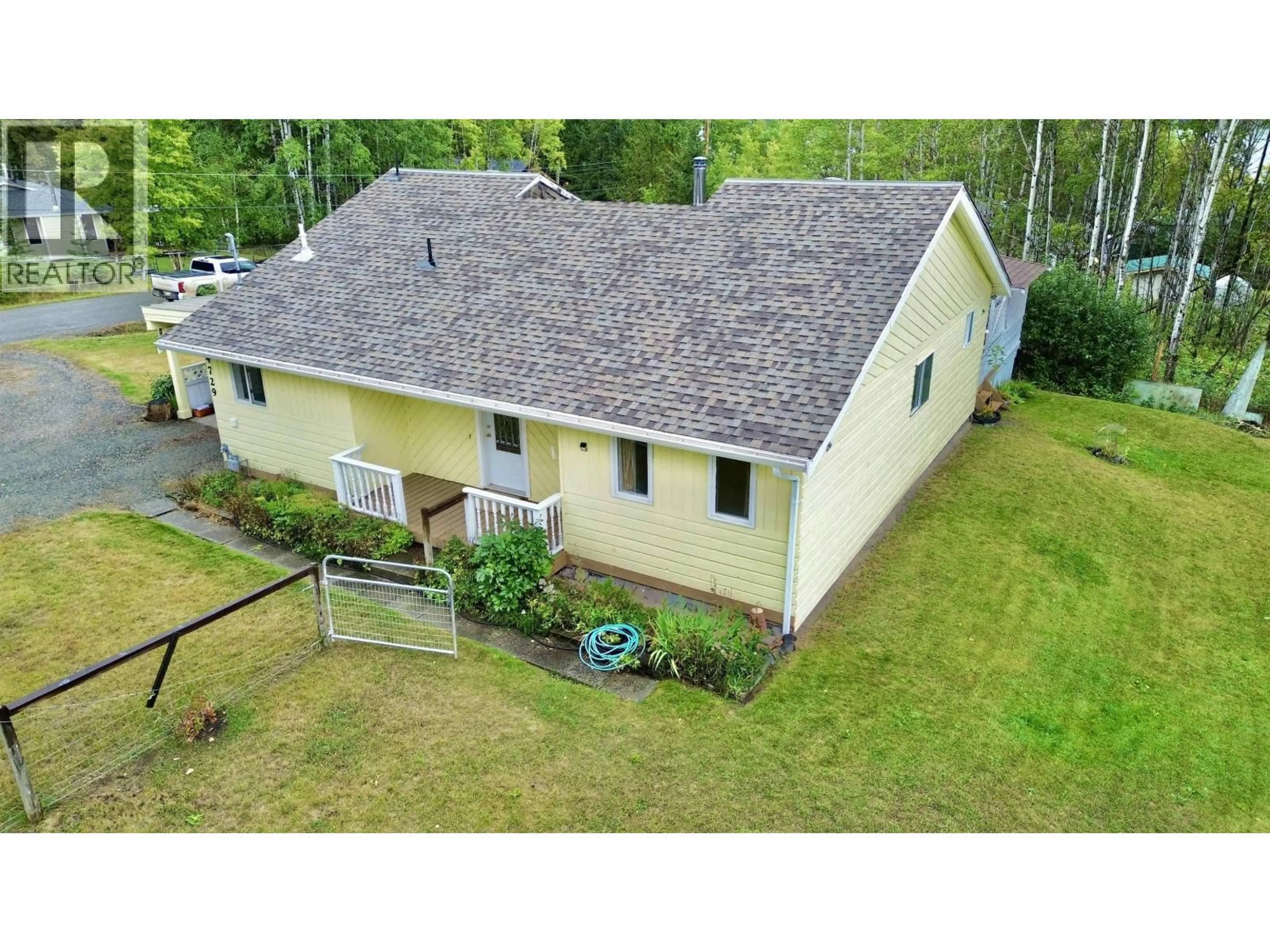 A pic from outside/outdoor area/front of a property/back of a property/a pic from drone, unknown for 4729 KITWANGA DRIVE, 108 Mile Ranch British Columbia V0K2Z0