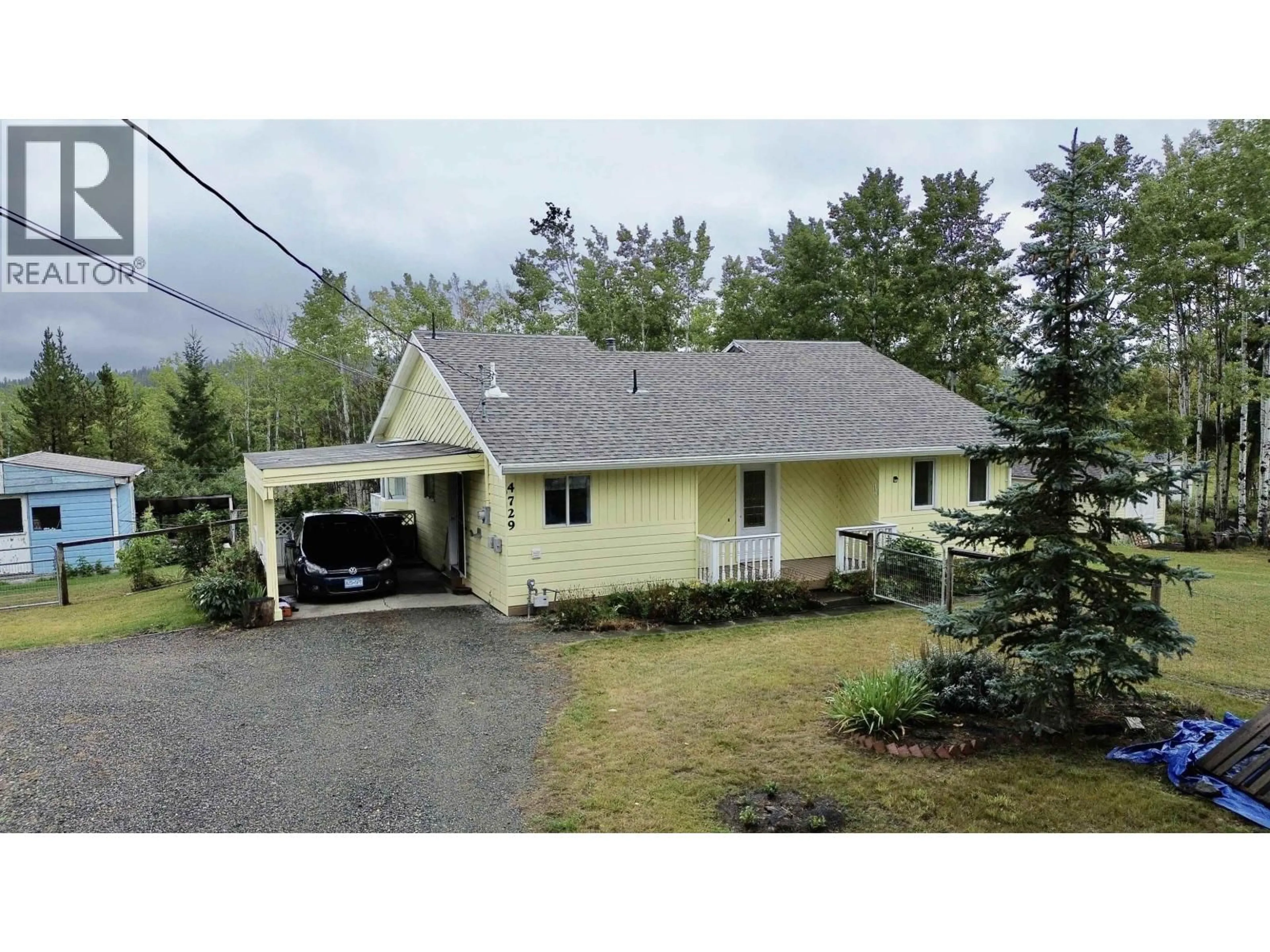 A pic from outside/outdoor area/front of a property/back of a property/a pic from drone, street for 4729 KITWANGA DRIVE, 108 Mile Ranch British Columbia V0K2Z0