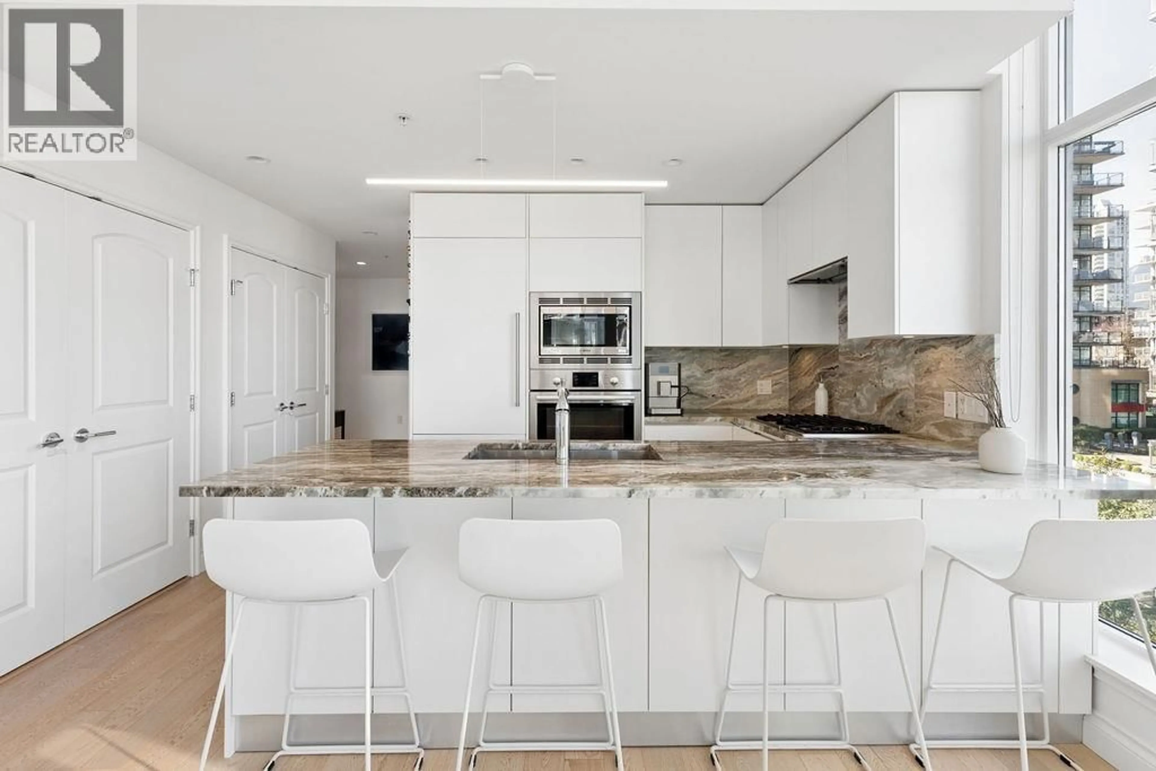 Contemporary kitchen, ceramic/tile floor for 409 - 185 VICTORY SHIP WAY, North Vancouver British Columbia V7L0G2