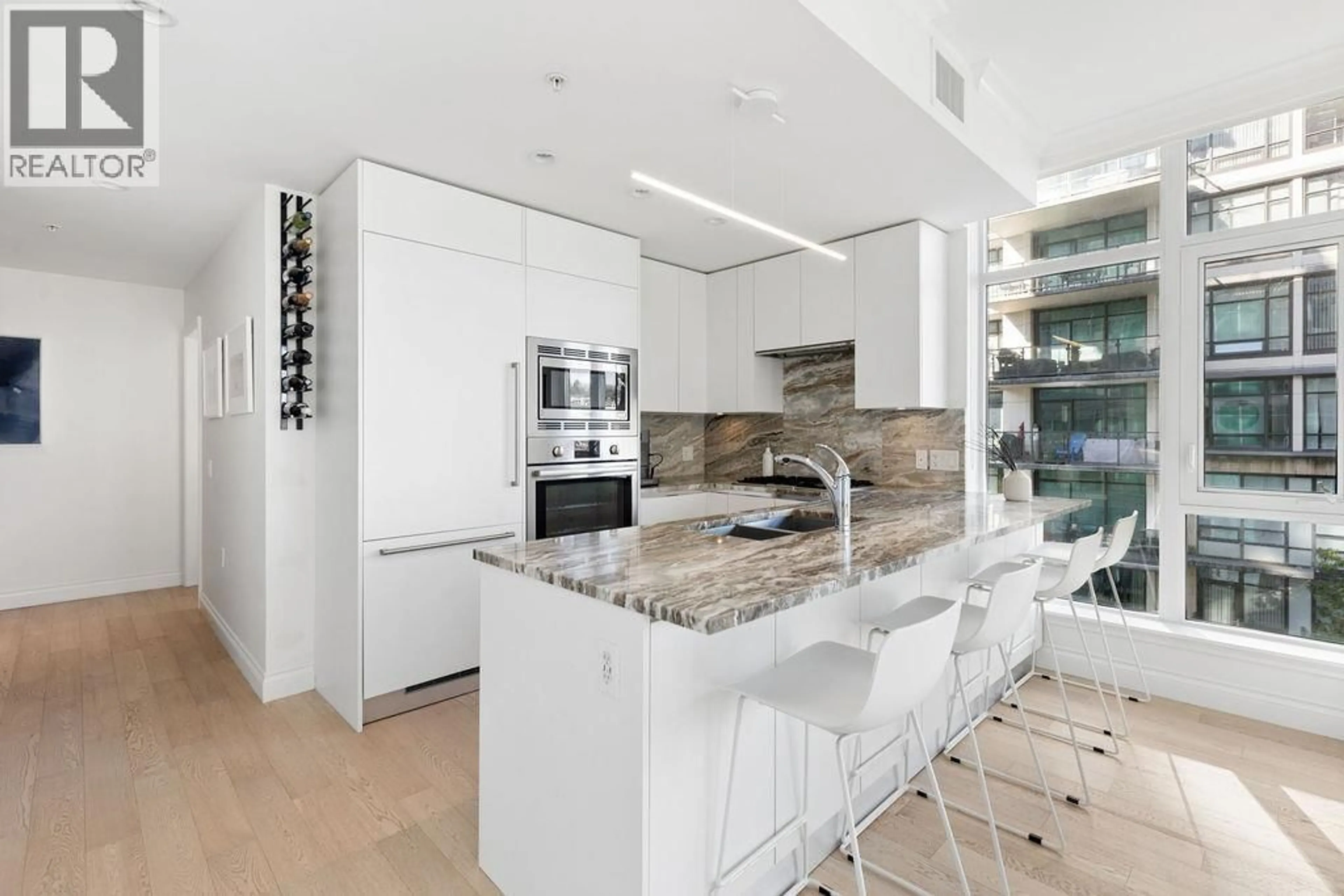 Contemporary kitchen, ceramic/tile floor for 409 - 185 VICTORY SHIP WAY, North Vancouver British Columbia V7L0G2