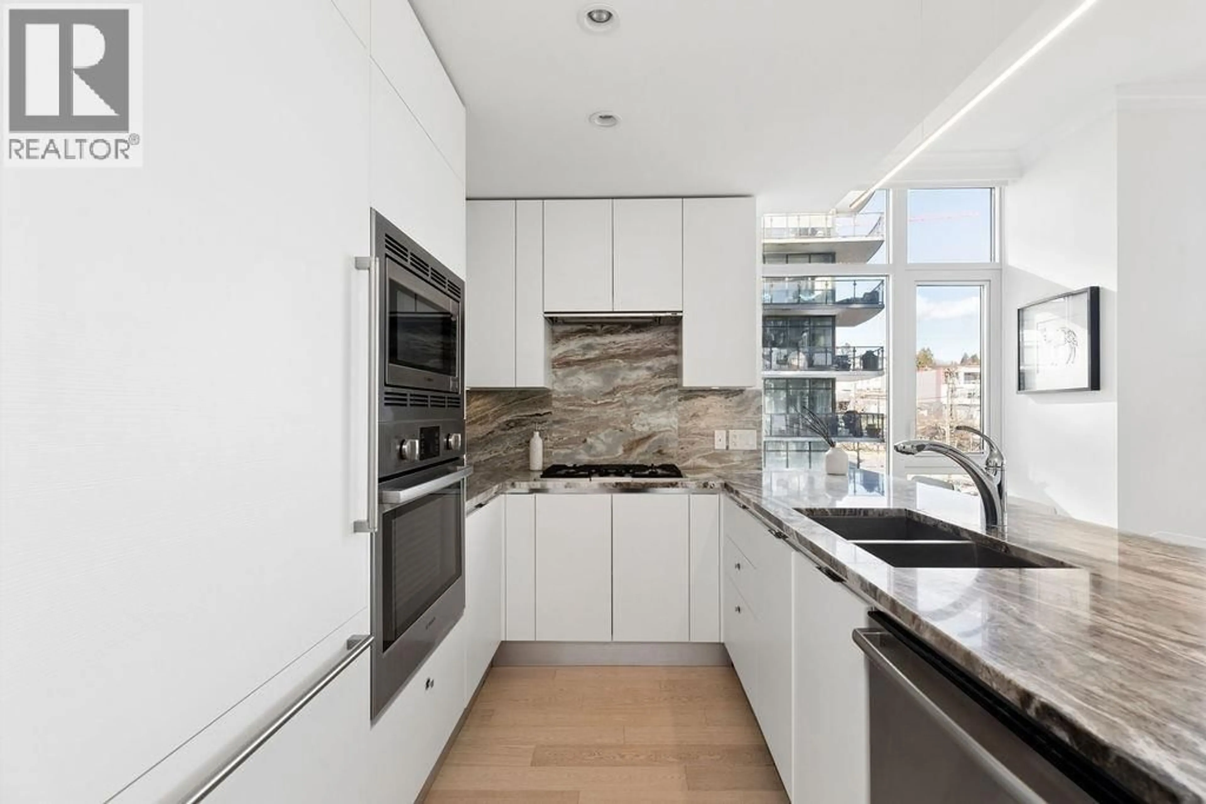 Contemporary kitchen, unknown for 409 - 185 VICTORY SHIP WAY, North Vancouver British Columbia V7L0G2