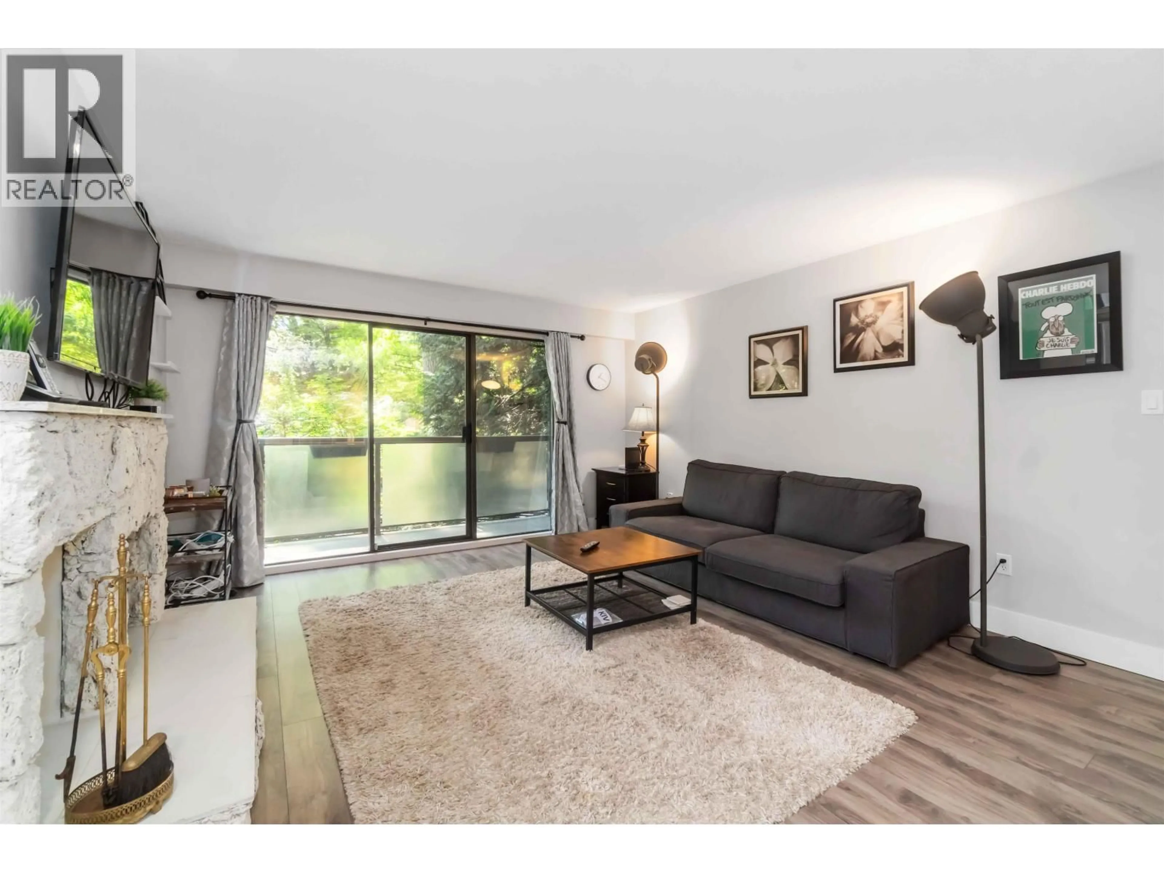 Living room with furniture, wood/laminate floor for 317 - 1345 15TH AVENUE, Vancouver British Columbia V6H3R3
