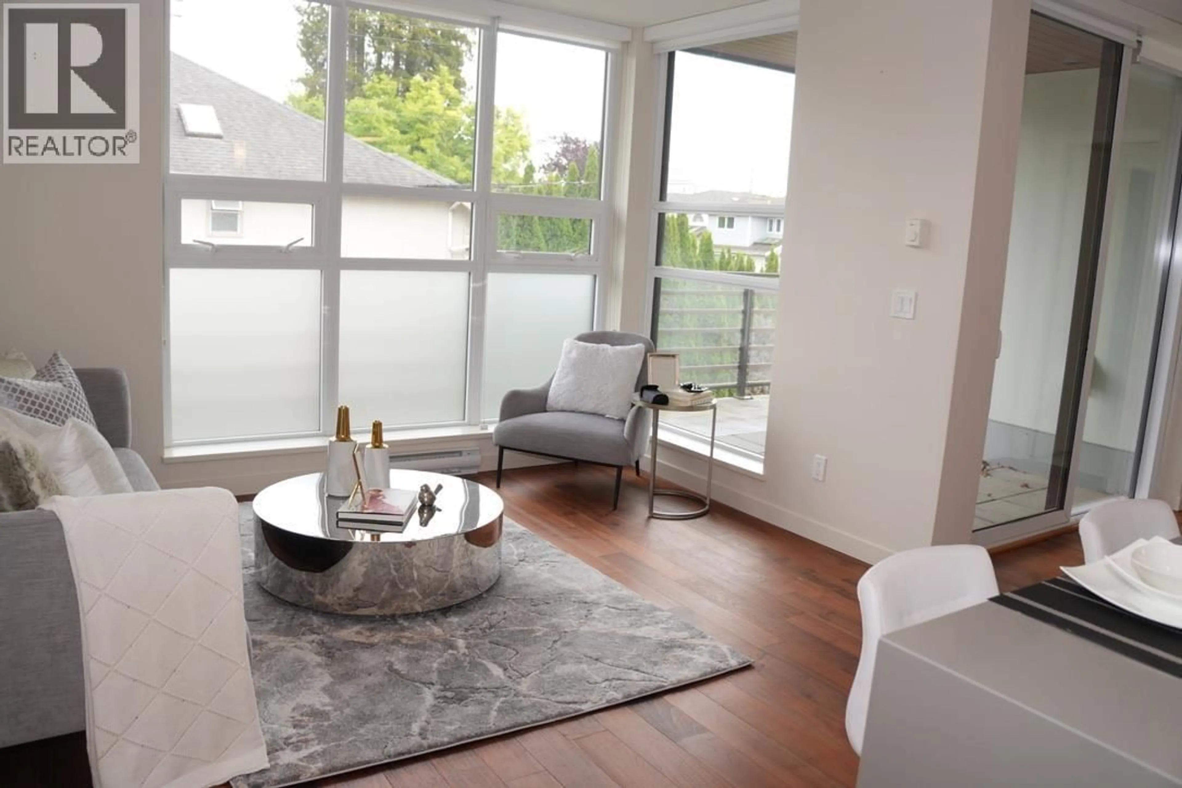 Living room with furniture, wood/laminate floor for 203 - 2095 44TH AVENUE, Vancouver British Columbia V6M2G1