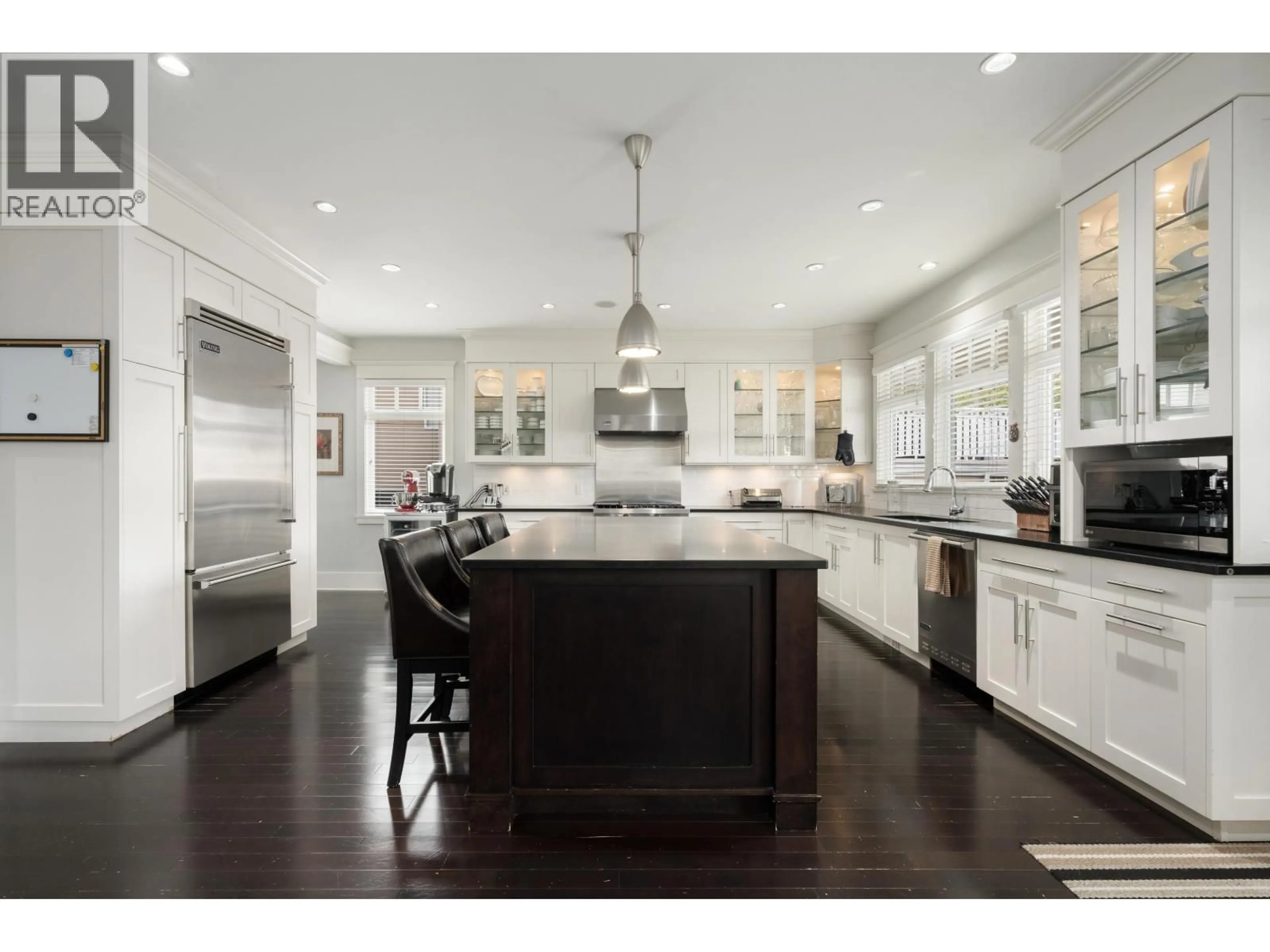 Open concept kitchen, wood/laminate floor for 3955 DUNDAS STREET, Burnaby British Columbia V5C1A6