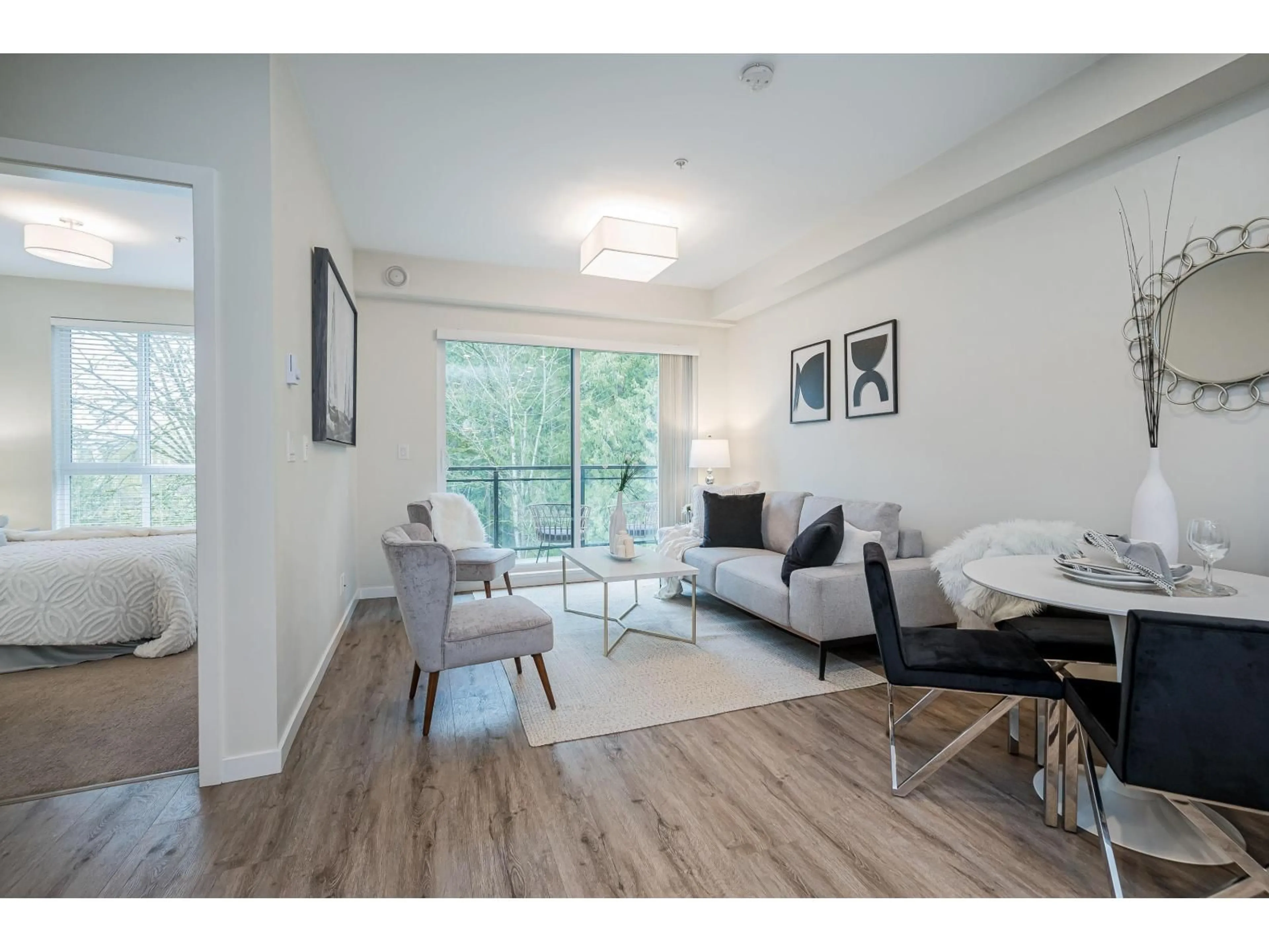 Living room with furniture, wood/laminate floor for A308 - 20087 68 AVENUE, Langley British Columbia V2Y0Y2