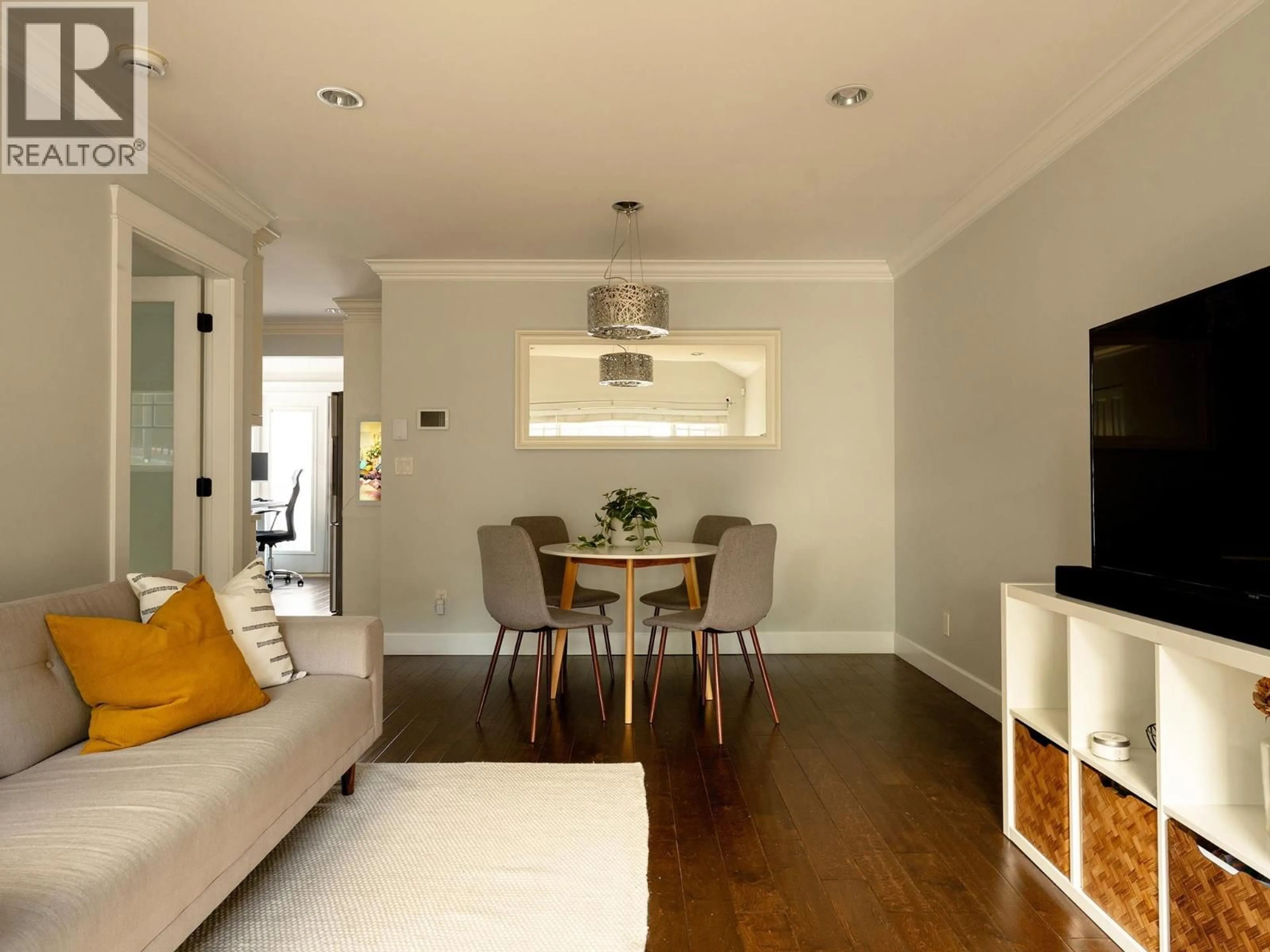 Living room with furniture, wood/laminate floor for 4883 BEATRICE STREET, Vancouver British Columbia V5N4J5