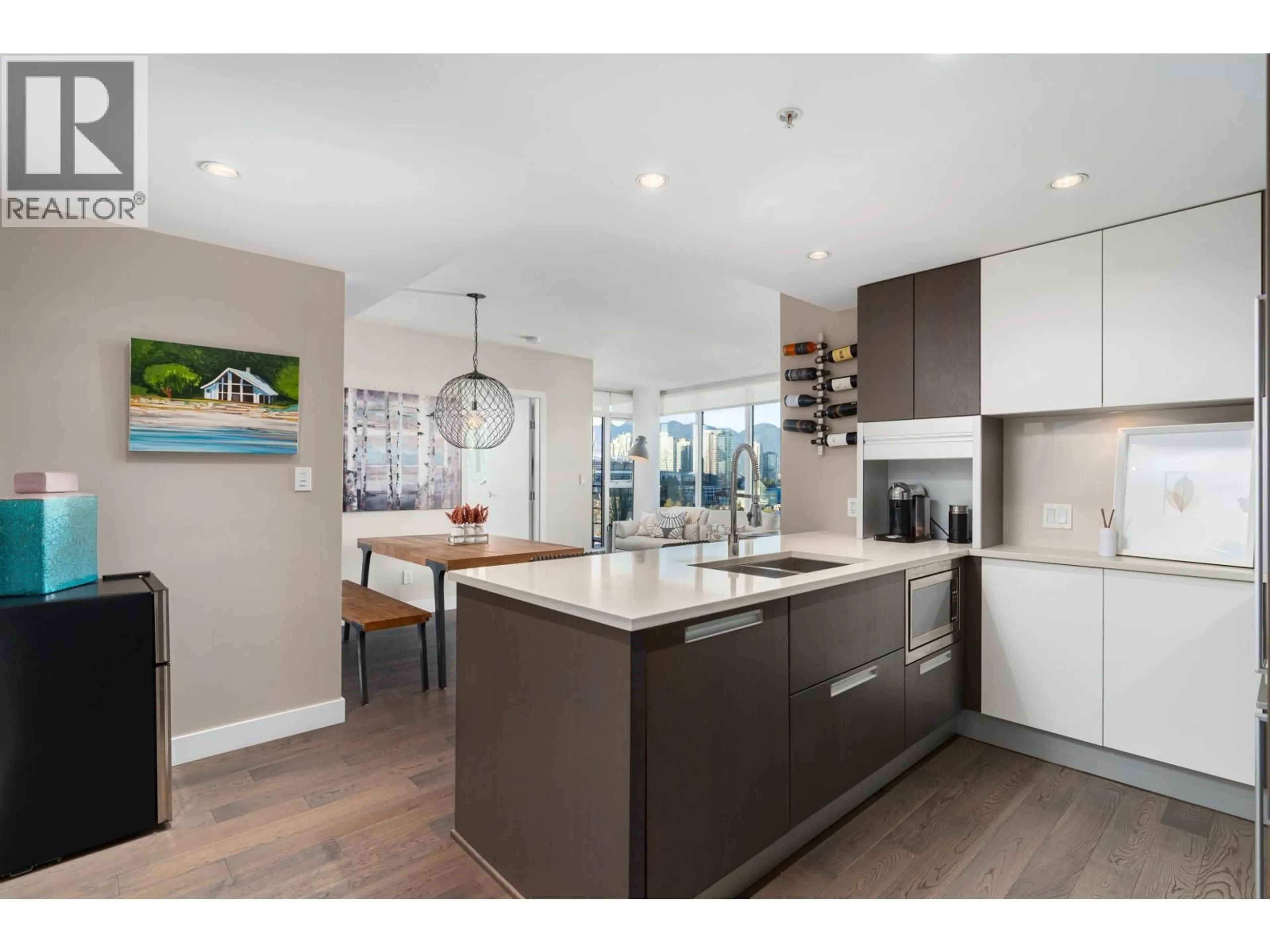 Open concept kitchen, wood/laminate floor for 1107 - 288 1ST AVENUE, Vancouver British Columbia V5Y0E9