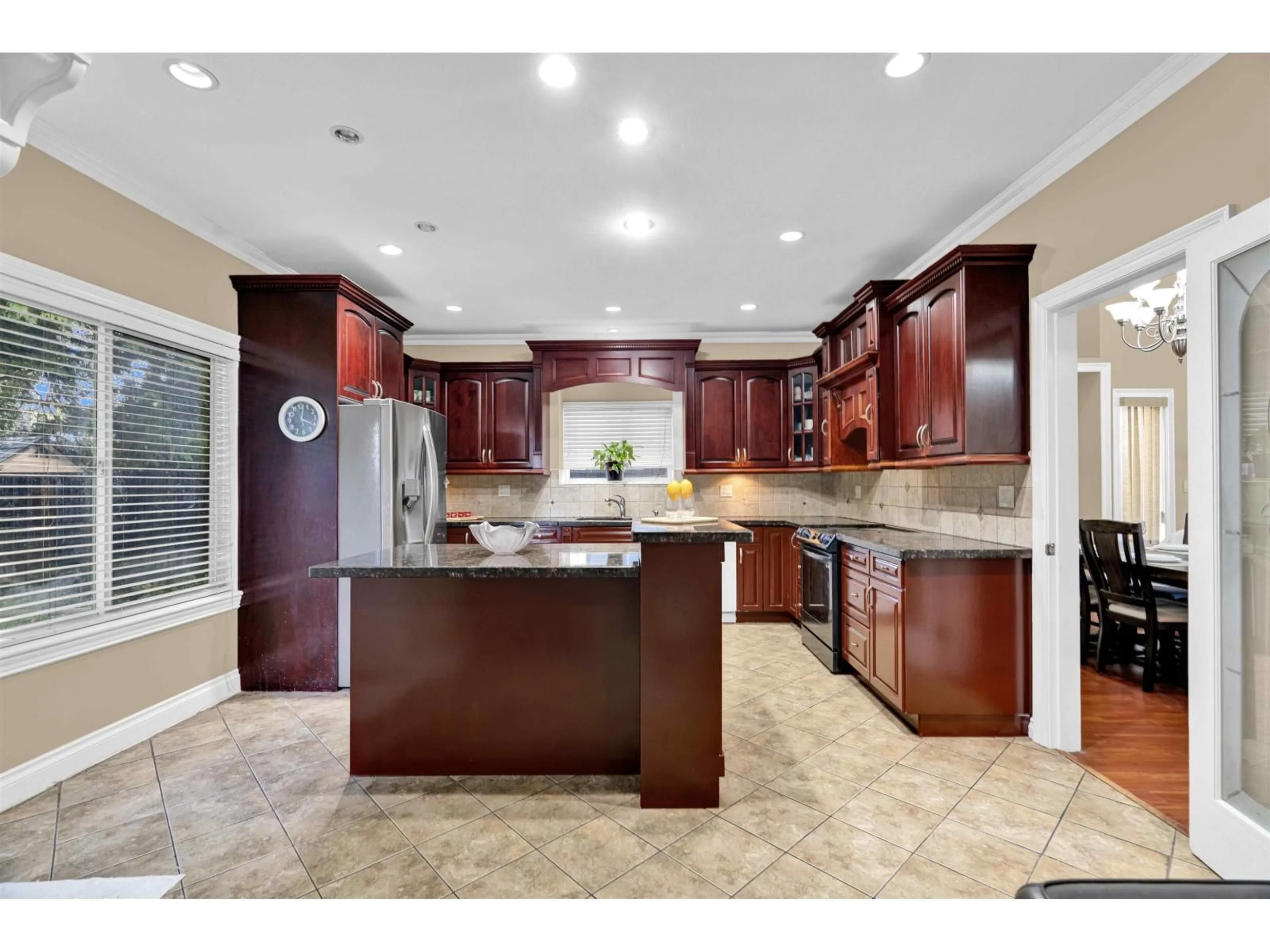 Open concept kitchen, ceramic/tile floor for 8179 112 STREET, Delta British Columbia V4C4W4