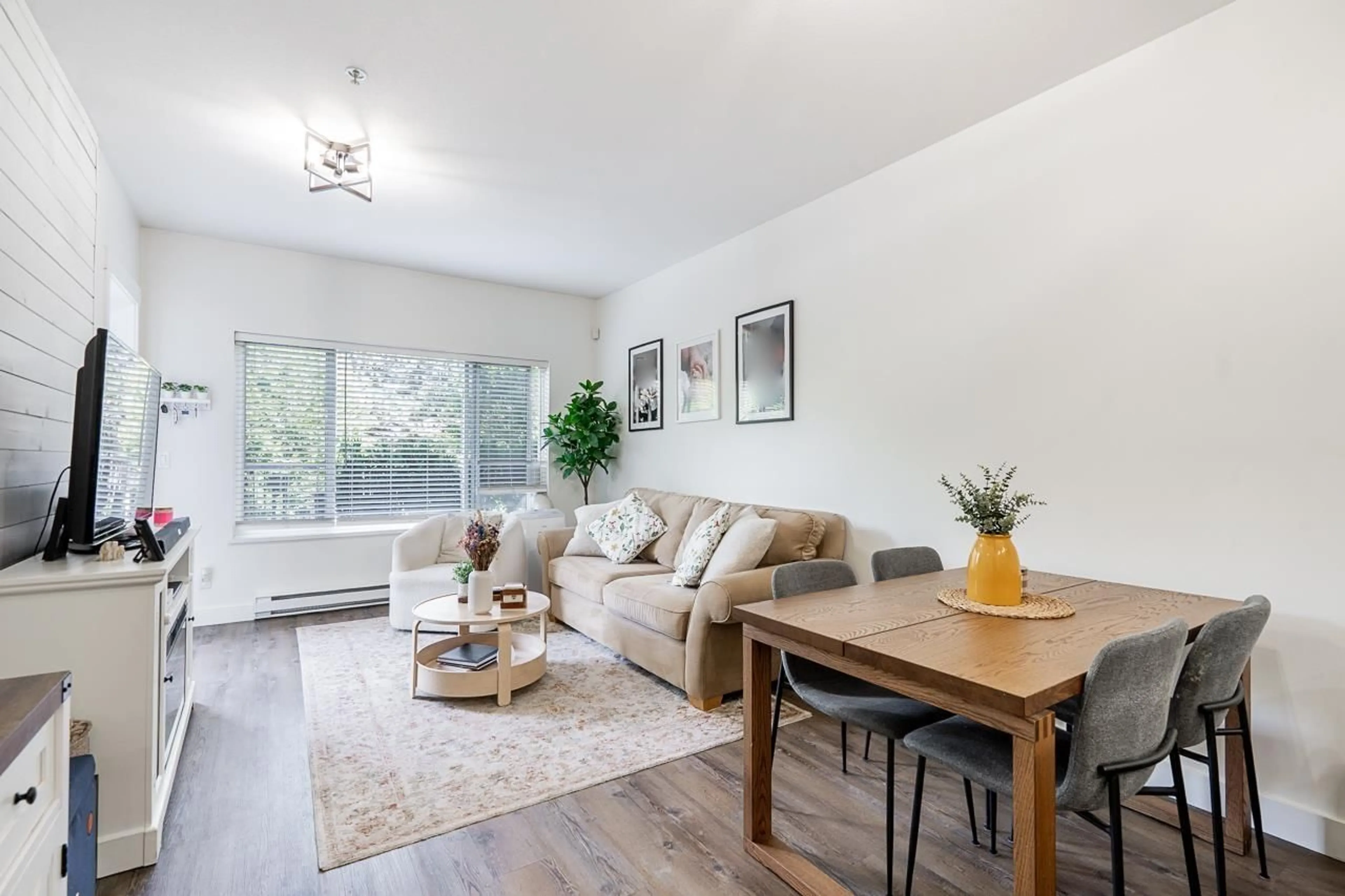 Living room with furniture, wood/laminate floor for 115 - 2943 NELSON PLACE, Abbotsford British Columbia V2S0C8