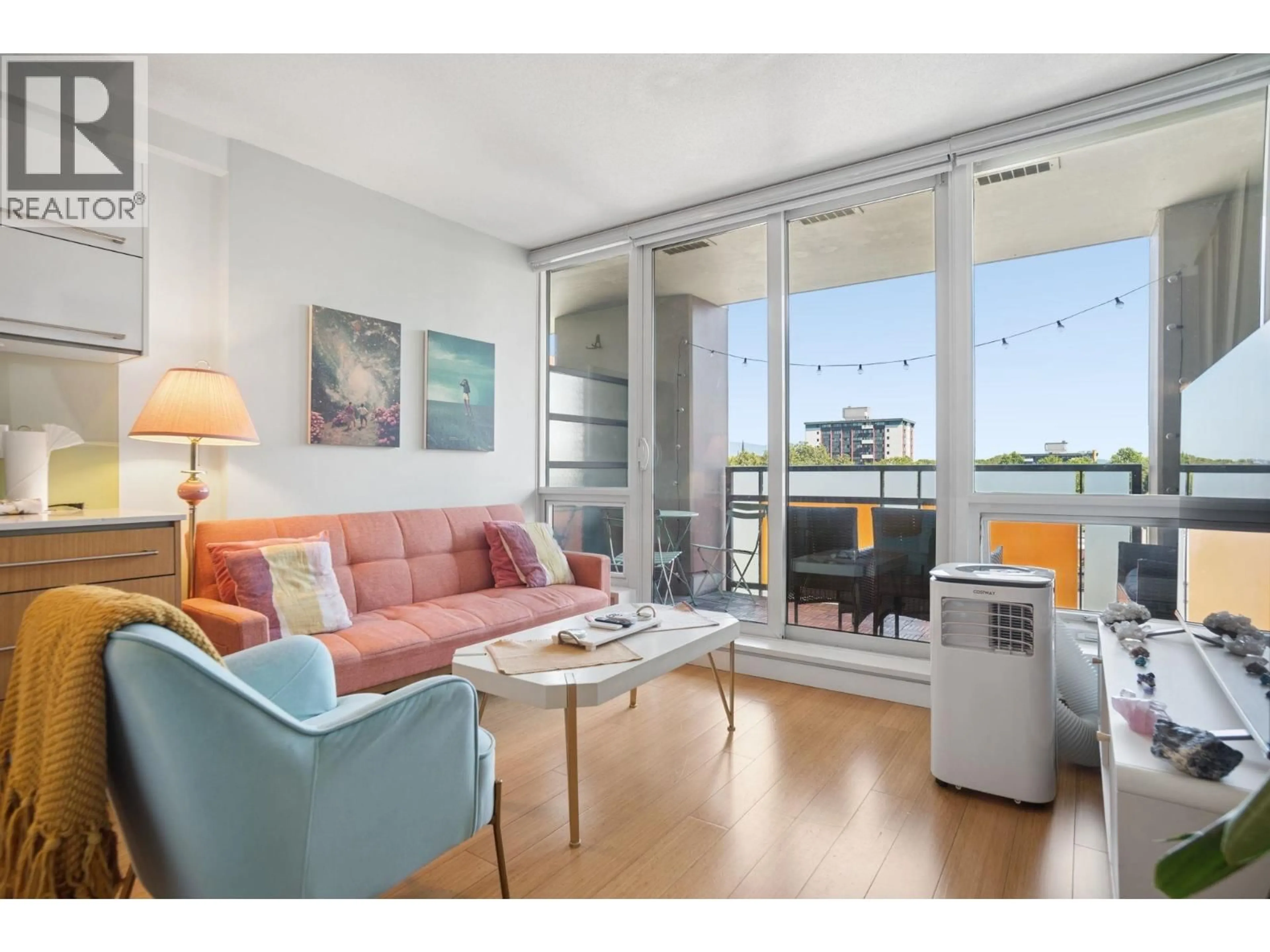 Living room with furniture, wood/laminate floor for 709 - 718 MAIN STREET, Vancouver British Columbia V6A0B1