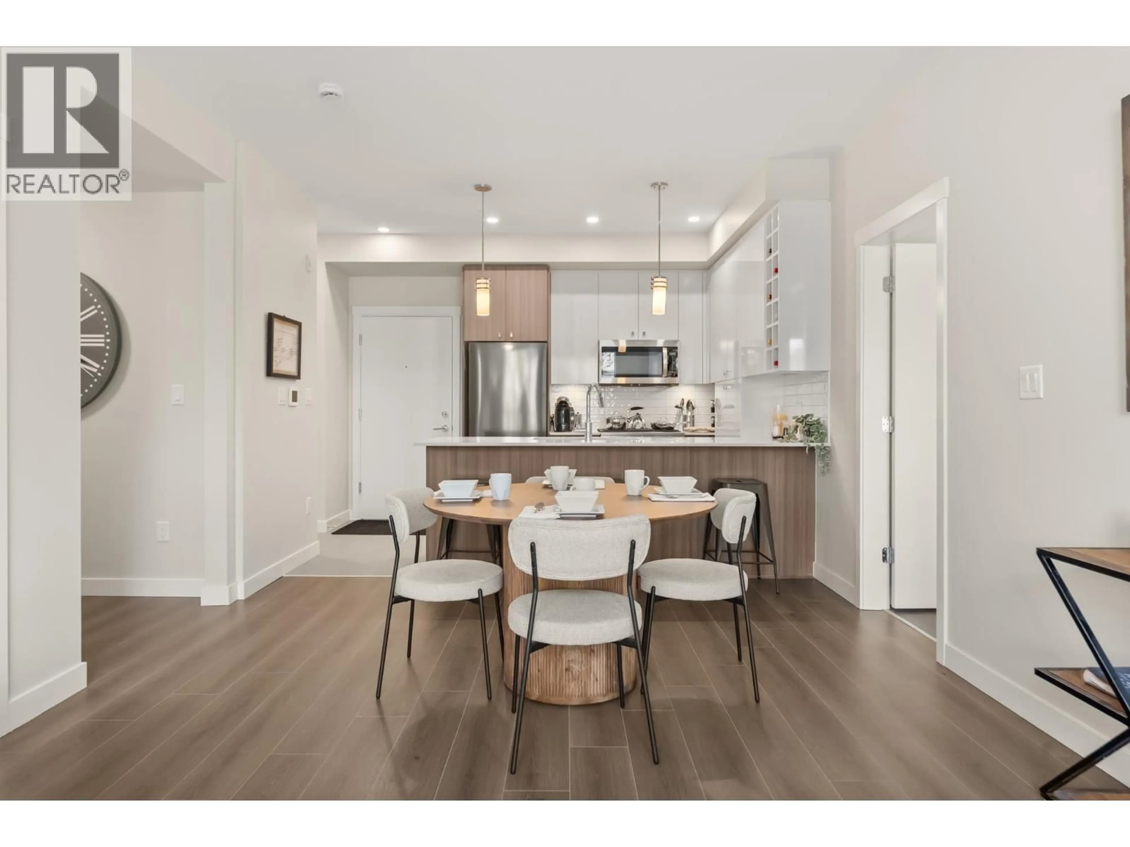 Open concept kitchen, wood/laminate floor for 102 - 23222 GILLEY ROAD, Richmond British Columbia V6V0C8