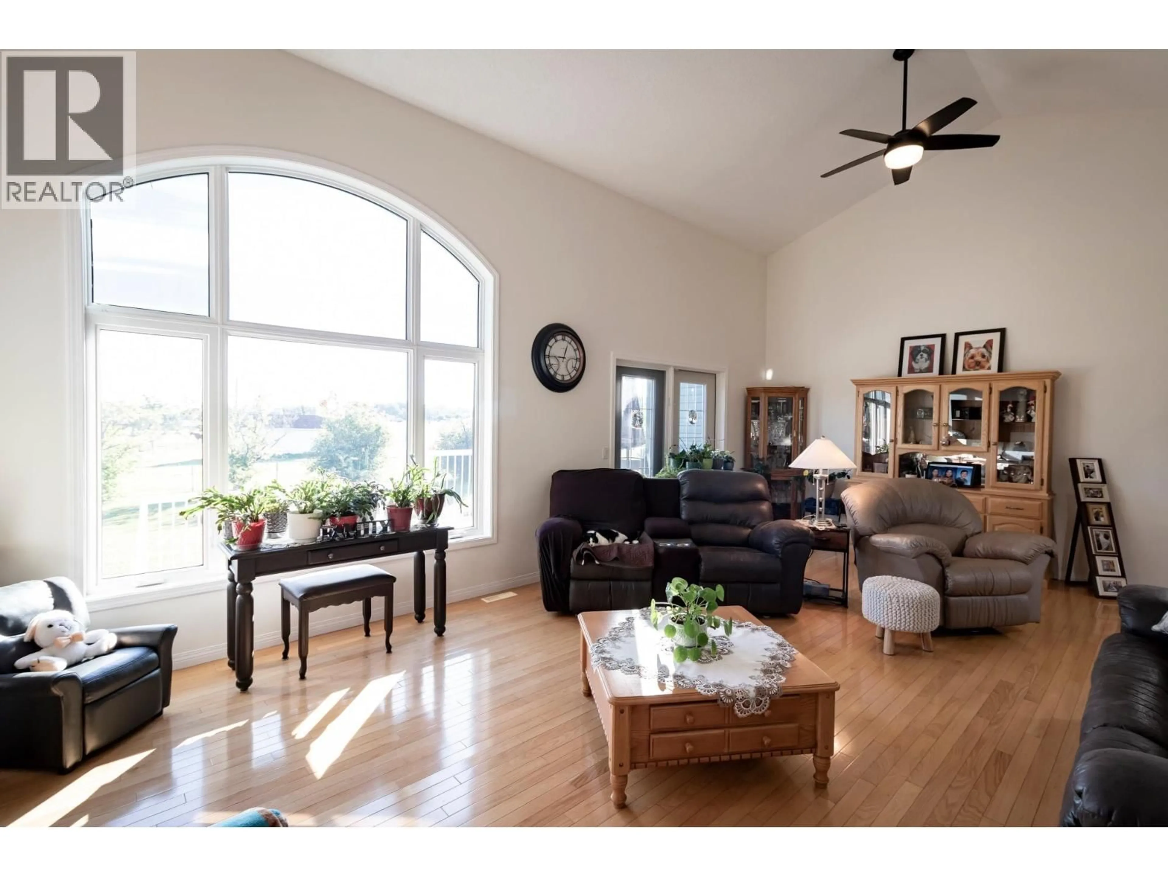Living room with furniture, wood/laminate floor for 12098 91 STREET, Fort St. John British Columbia V1J8C3