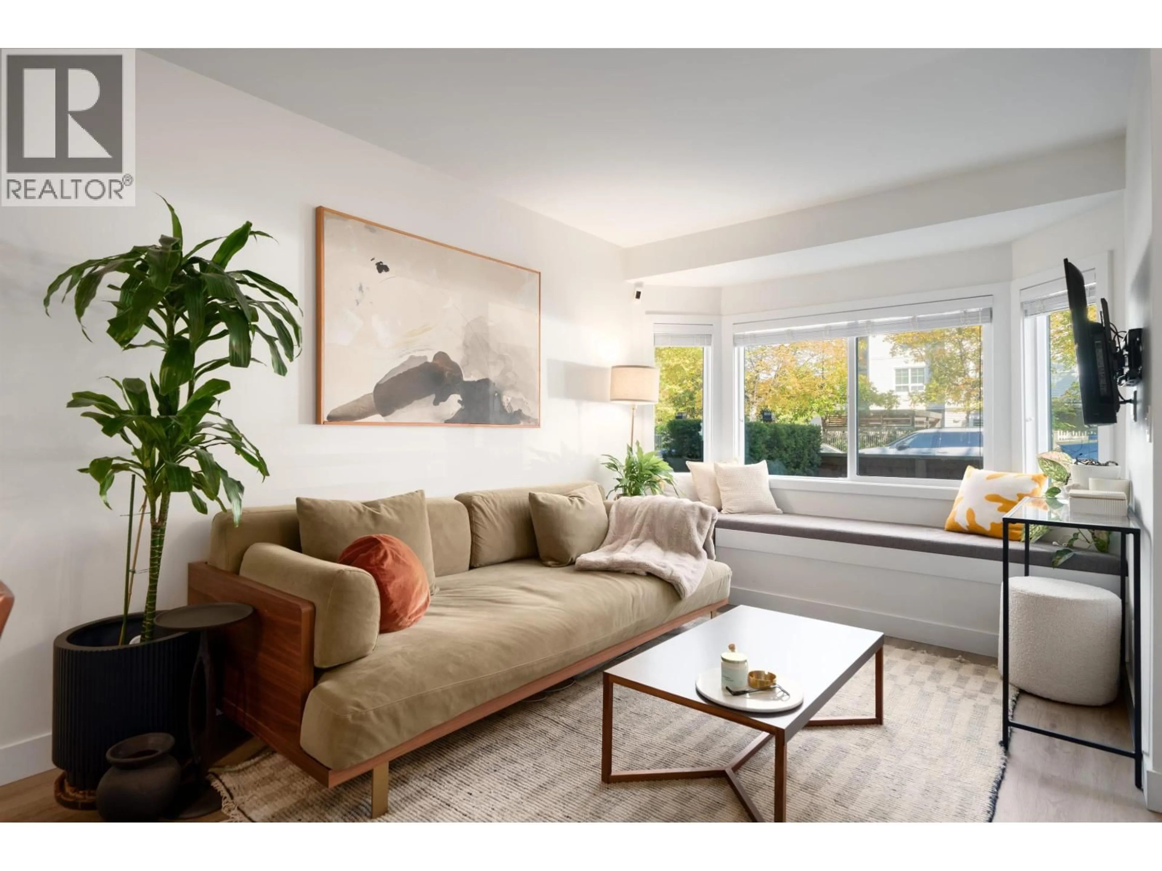 Living room with furniture, wood/laminate floor for 329 GARDEN DRIVE, Vancouver British Columbia V5L4Z1