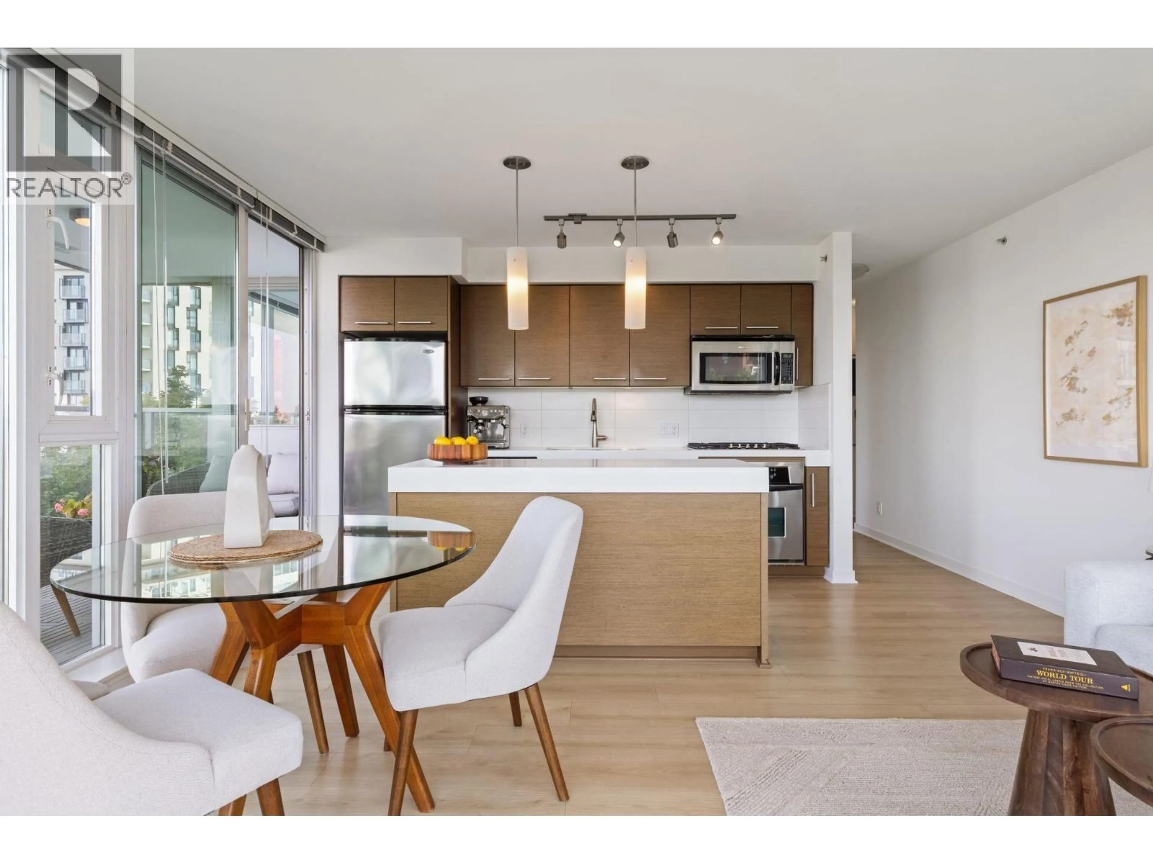 Open concept kitchen, wood/laminate floor for 501 - 2770 SOPHIA STREET, Vancouver British Columbia V5T0A4