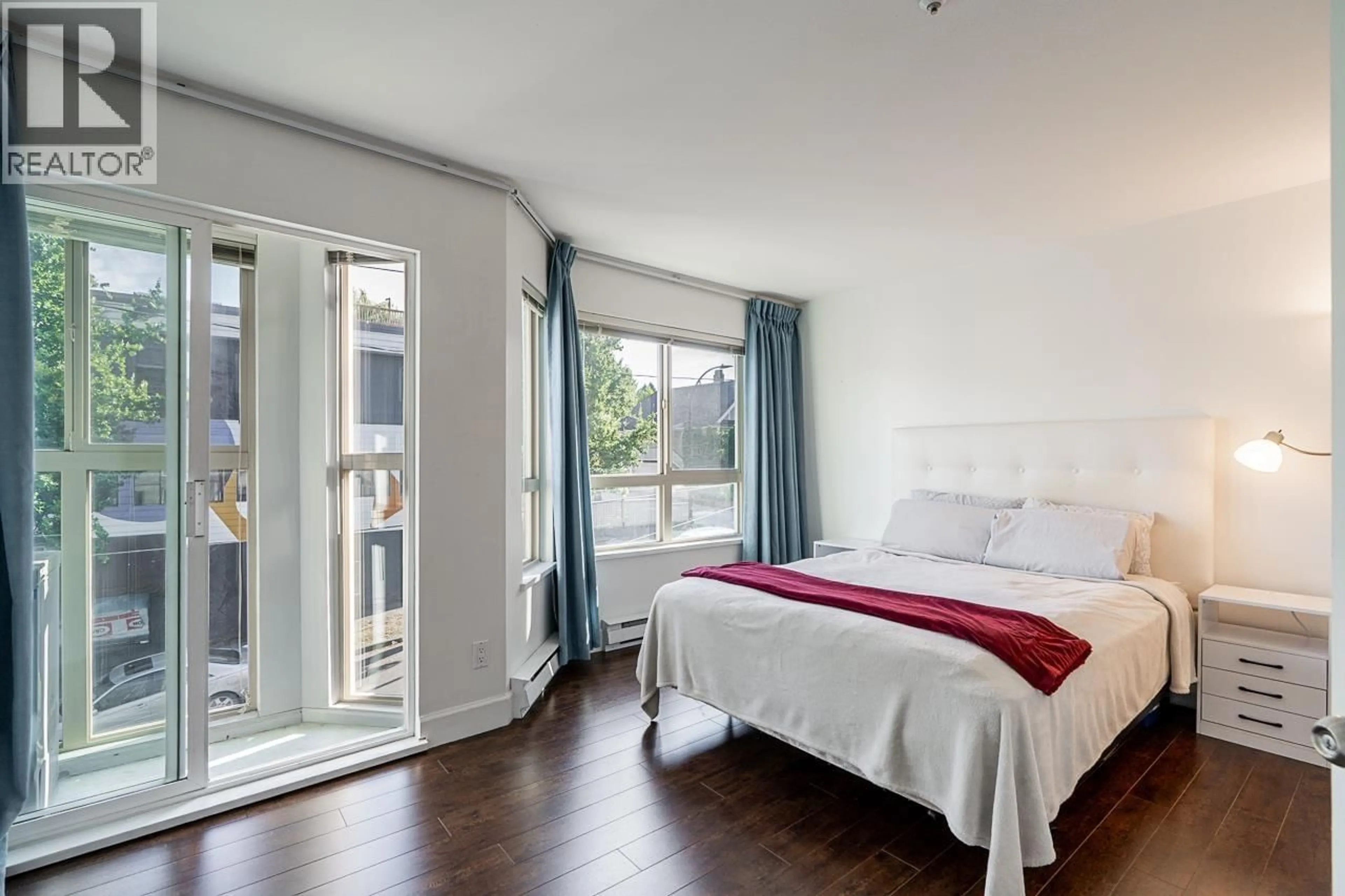 Bedroom with bed, wood/laminate floor for 206 - 3615 17TH AVENUE, Vancouver British Columbia V6S1A3