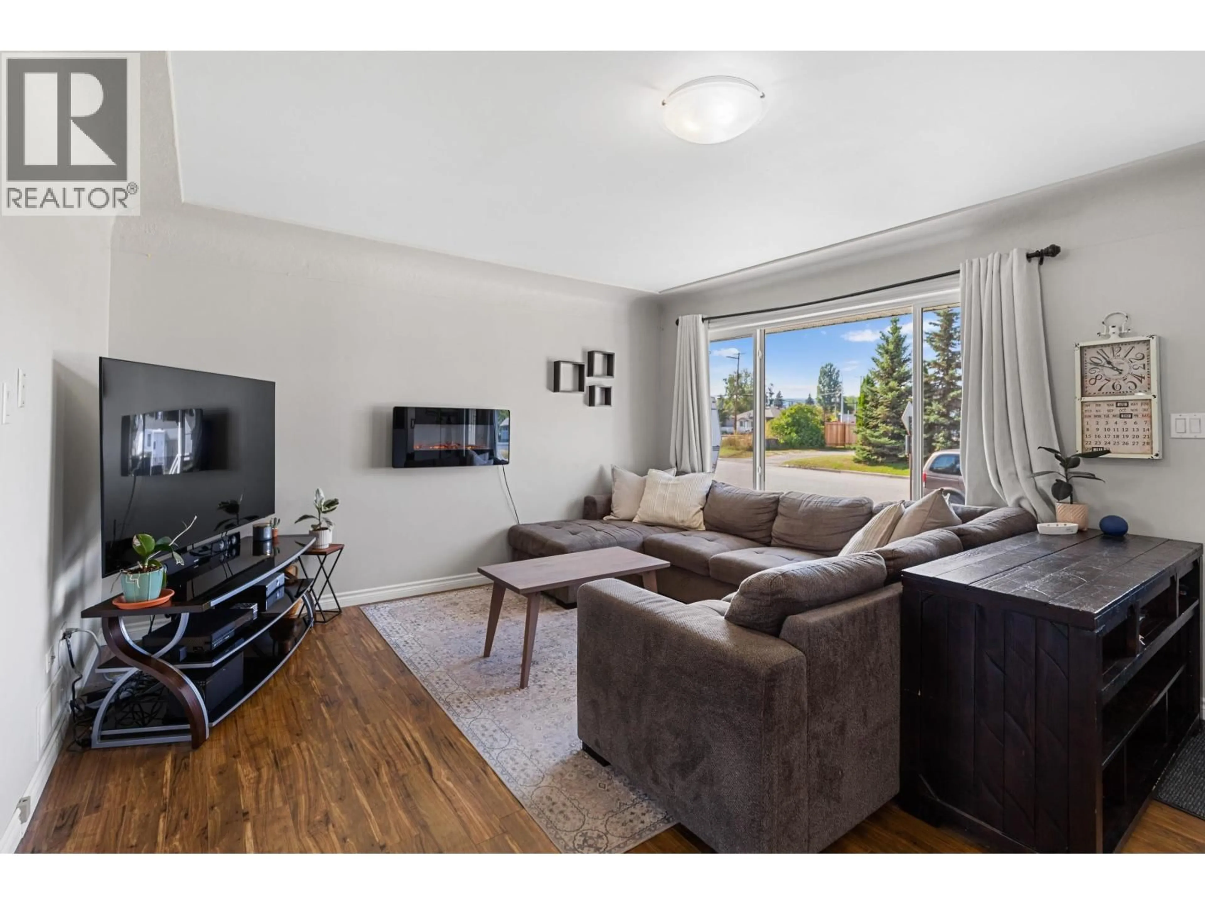 Living room with furniture, wood/laminate floor for 444 WAINWRIGHT STREET, Prince George British Columbia V2M2C4