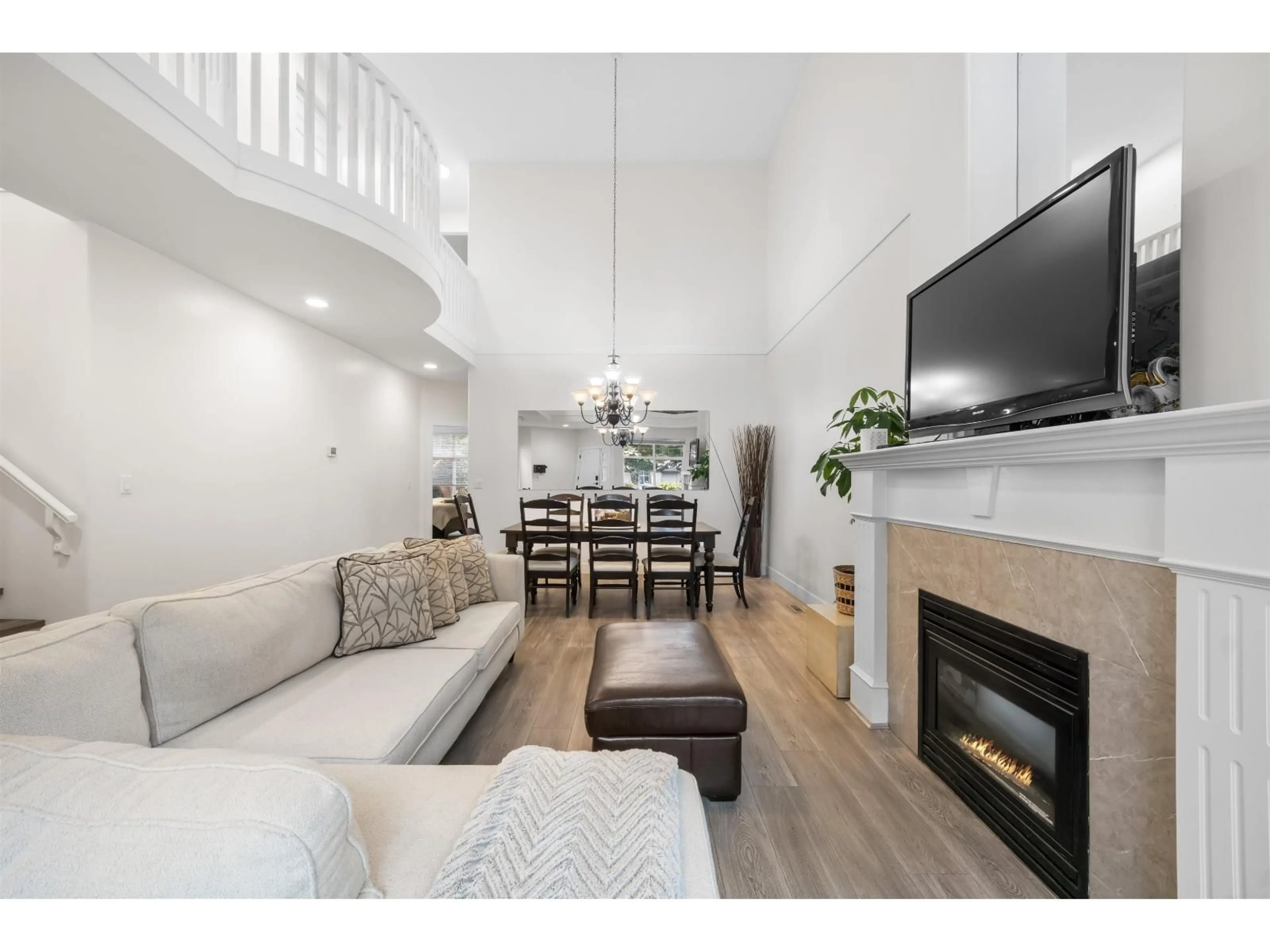Living room with furniture, wood/laminate floor for 5814 122 STREET, Surrey British Columbia V3X3L5