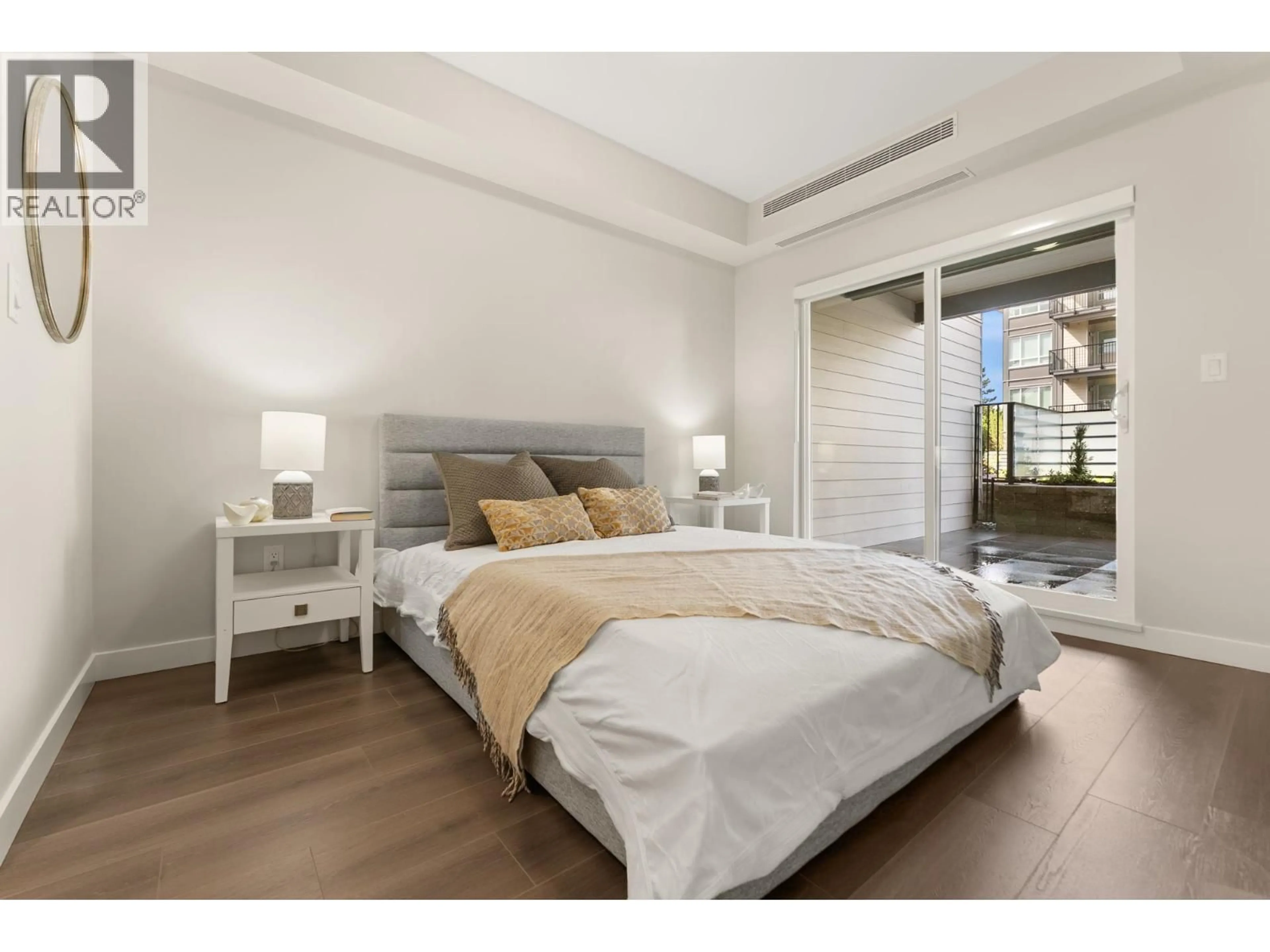 Bedroom with bed, wood/laminate floor for 403 - 23200 GILLEY ROAD, Richmond British Columbia V6V0C8