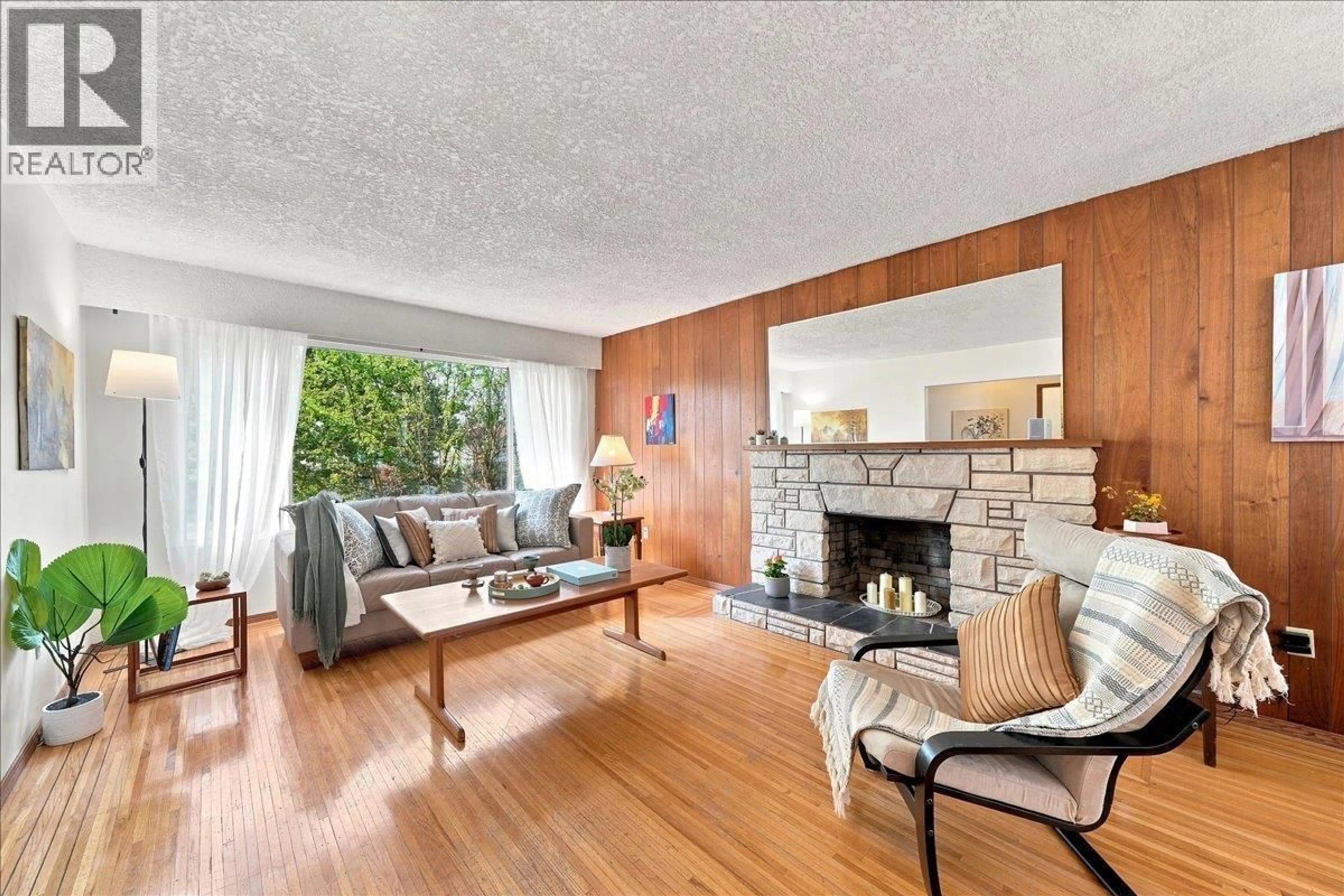 Living room with furniture, wood/laminate floor for 5884 ORMIDALE STREET, Vancouver British Columbia V5R4R3