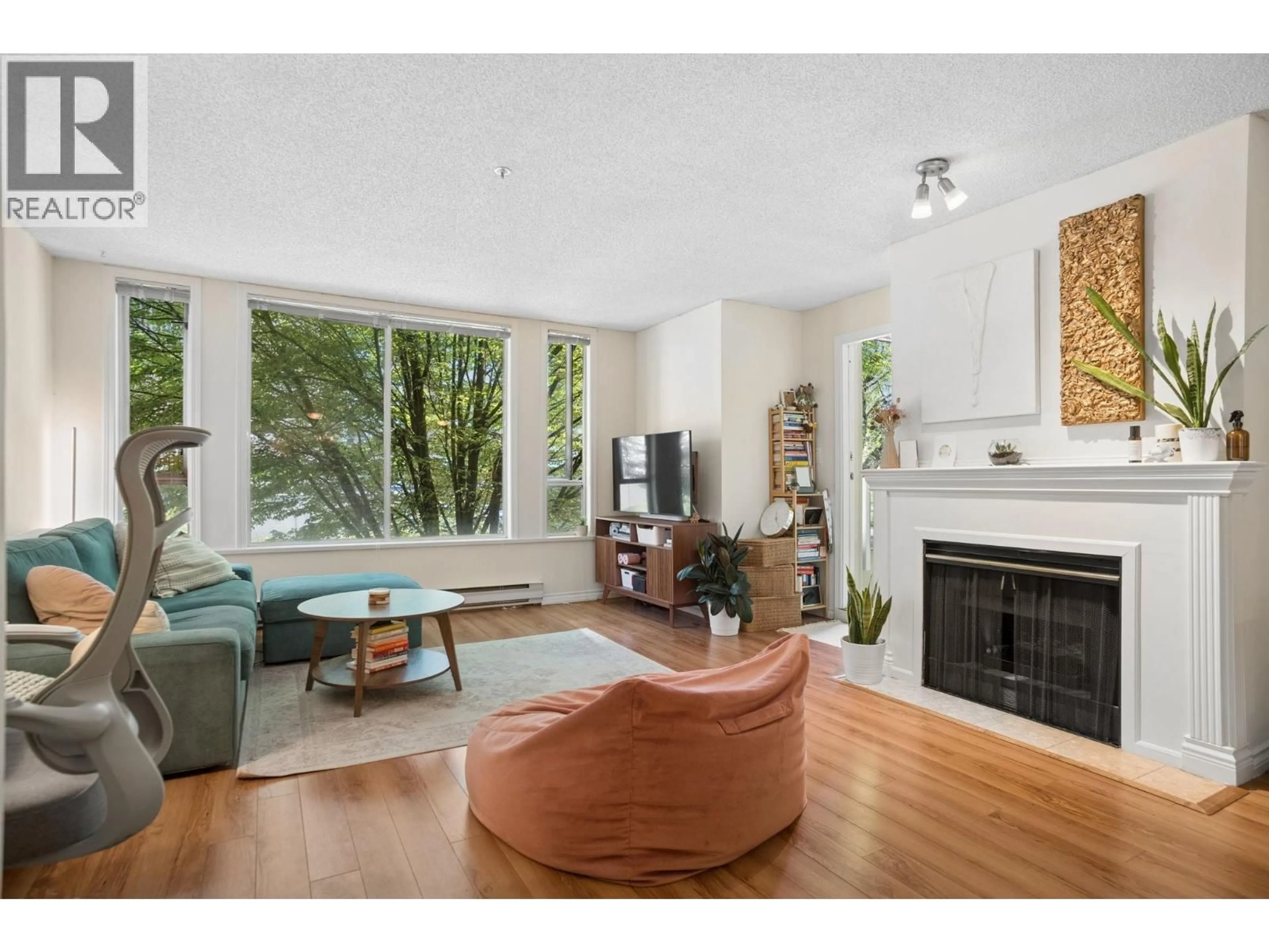 Living room with furniture, wood/laminate floor for 216 - 1230 HARO STREET, Vancouver British Columbia V6E4J9