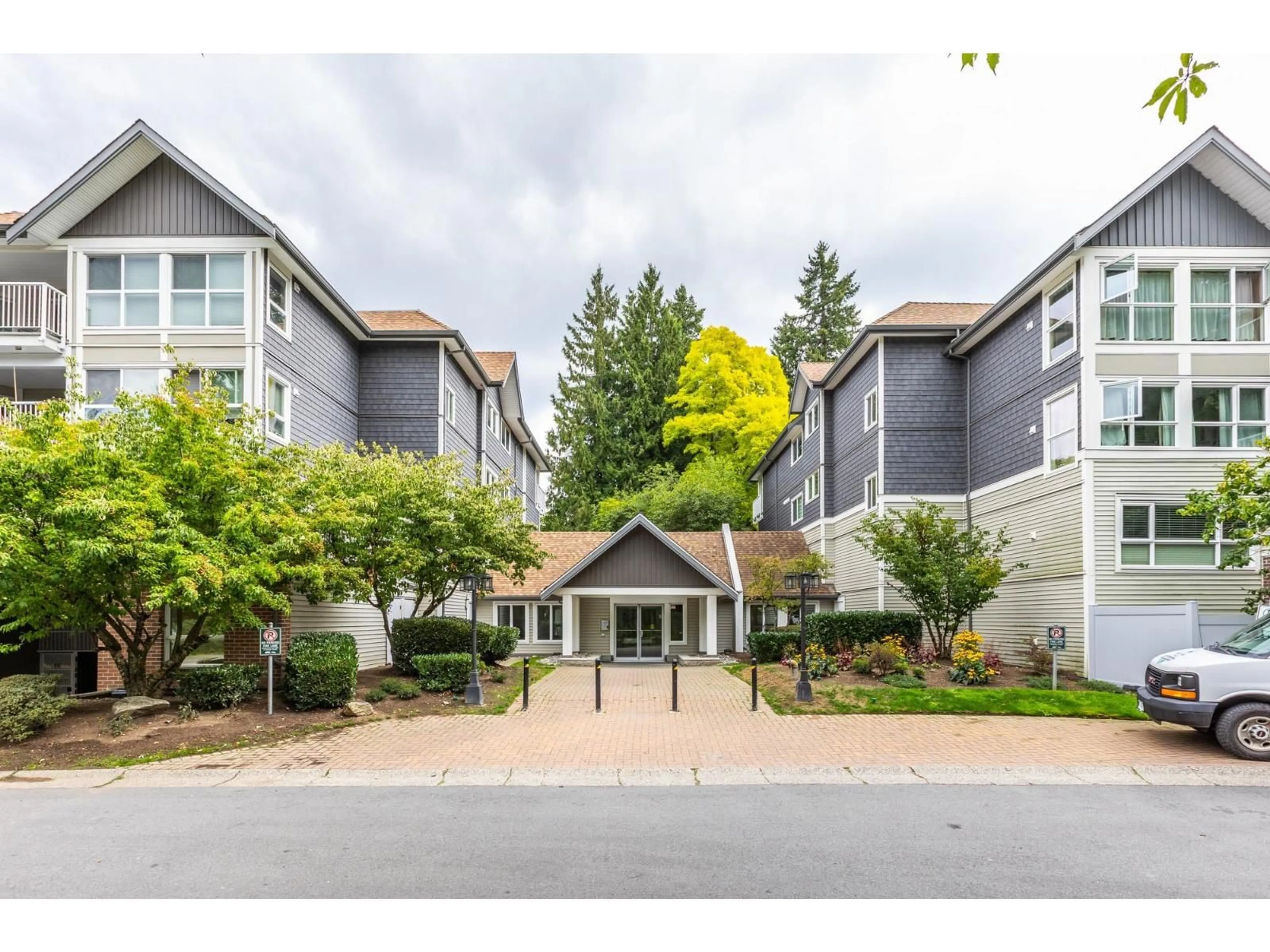 A pic from outside/outdoor area/front of a property/back of a property/a pic from drone, mountain view for 202 - 9688 148 STREET, Surrey British Columbia V3R0W2
