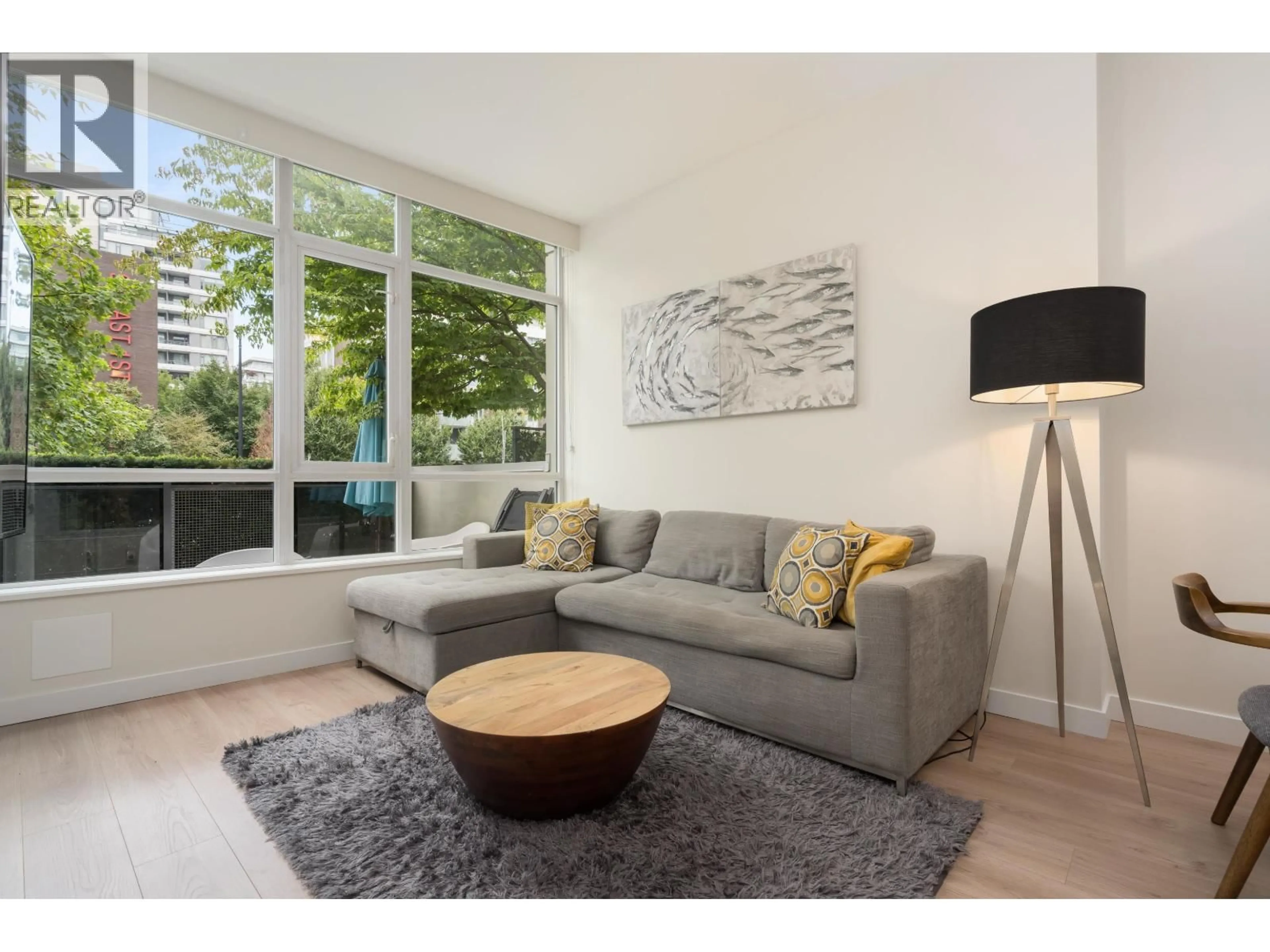 Living room with furniture, wood/laminate floor for 1680 QUEBEC STREET, Vancouver British Columbia V6A3L6