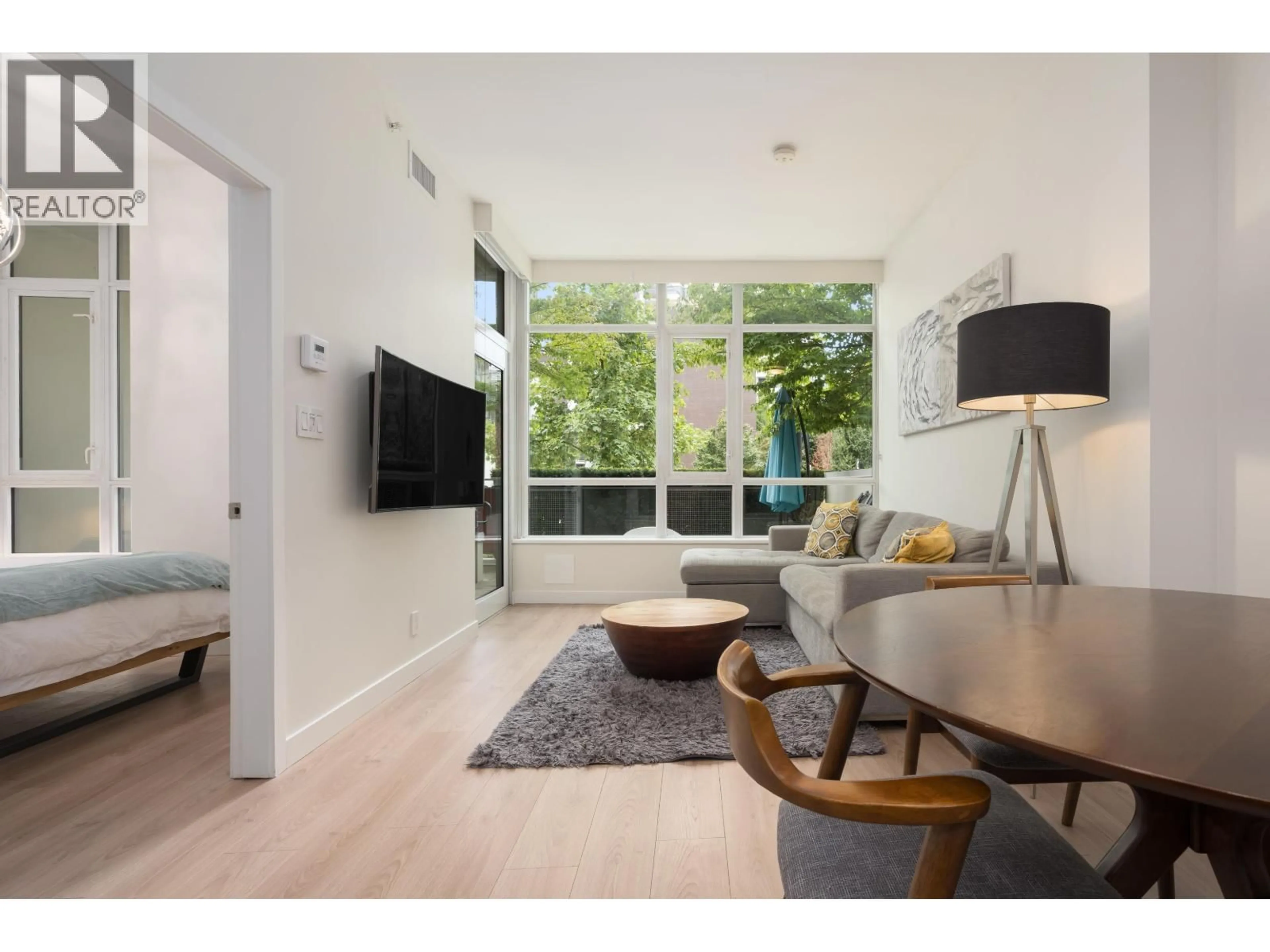 Living room with furniture, wood/laminate floor for 1680 QUEBEC STREET, Vancouver British Columbia V6A3L6