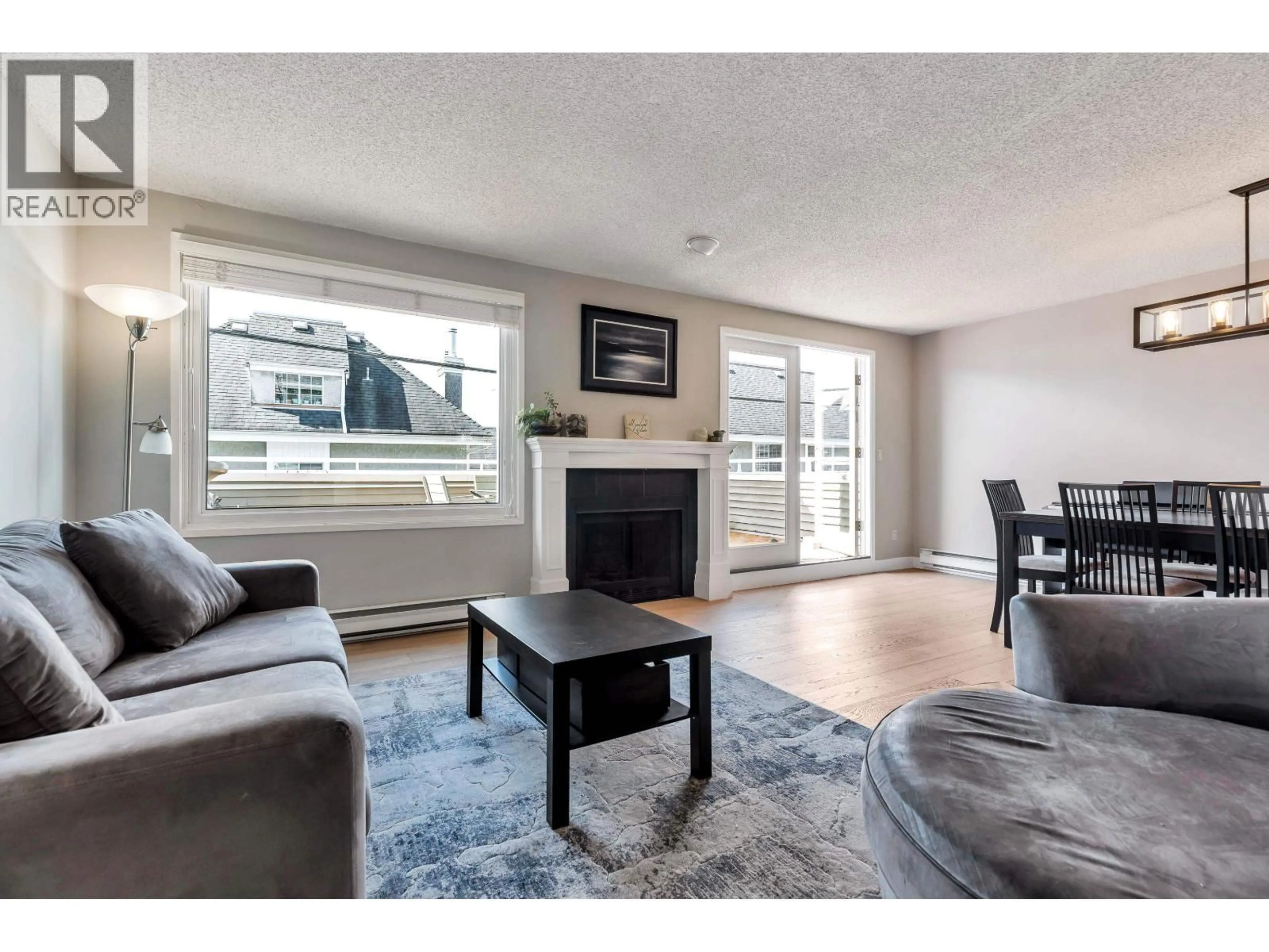 Living room with furniture, wood/laminate floor for 304 - 223 KEITH ROAD, North Vancouver British Columbia V7L1V4