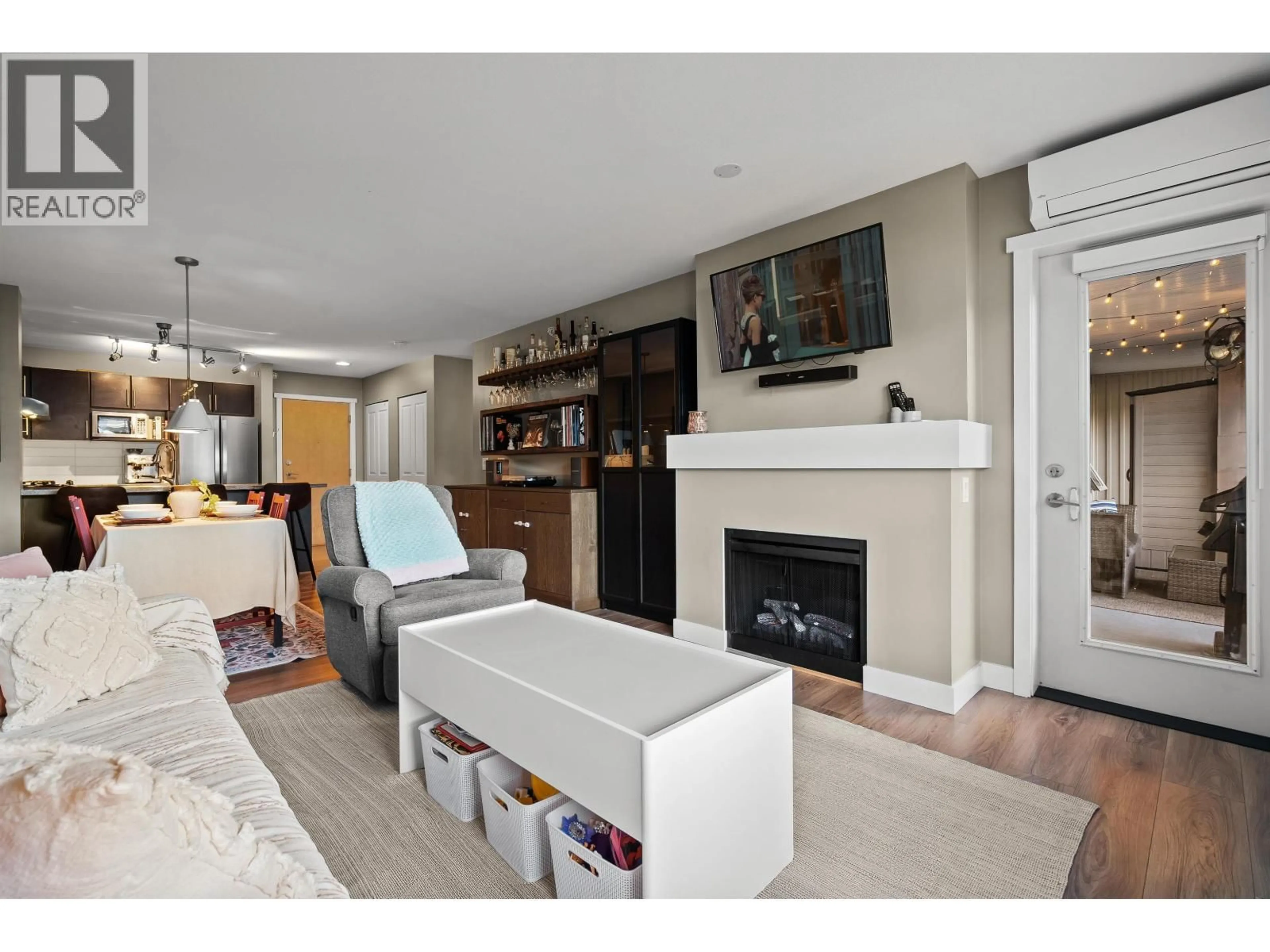 Living room with furniture, wood/laminate floor for 407 - 700 KLAHANIE DRIVE, Port Moody British Columbia V3H5L3