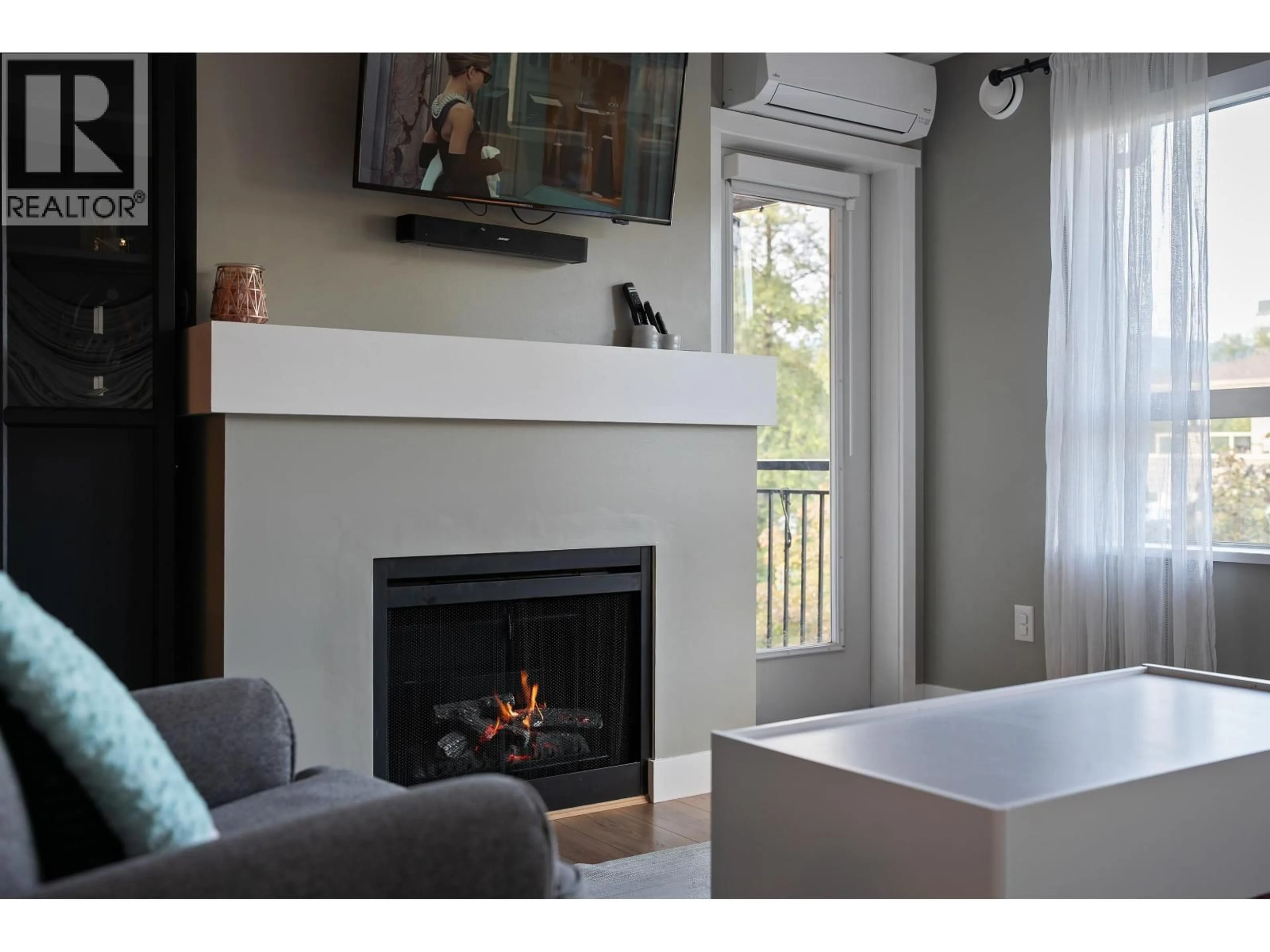 Living room with furniture, wood/laminate floor for 407 - 700 KLAHANIE DRIVE, Port Moody British Columbia V3H5L3