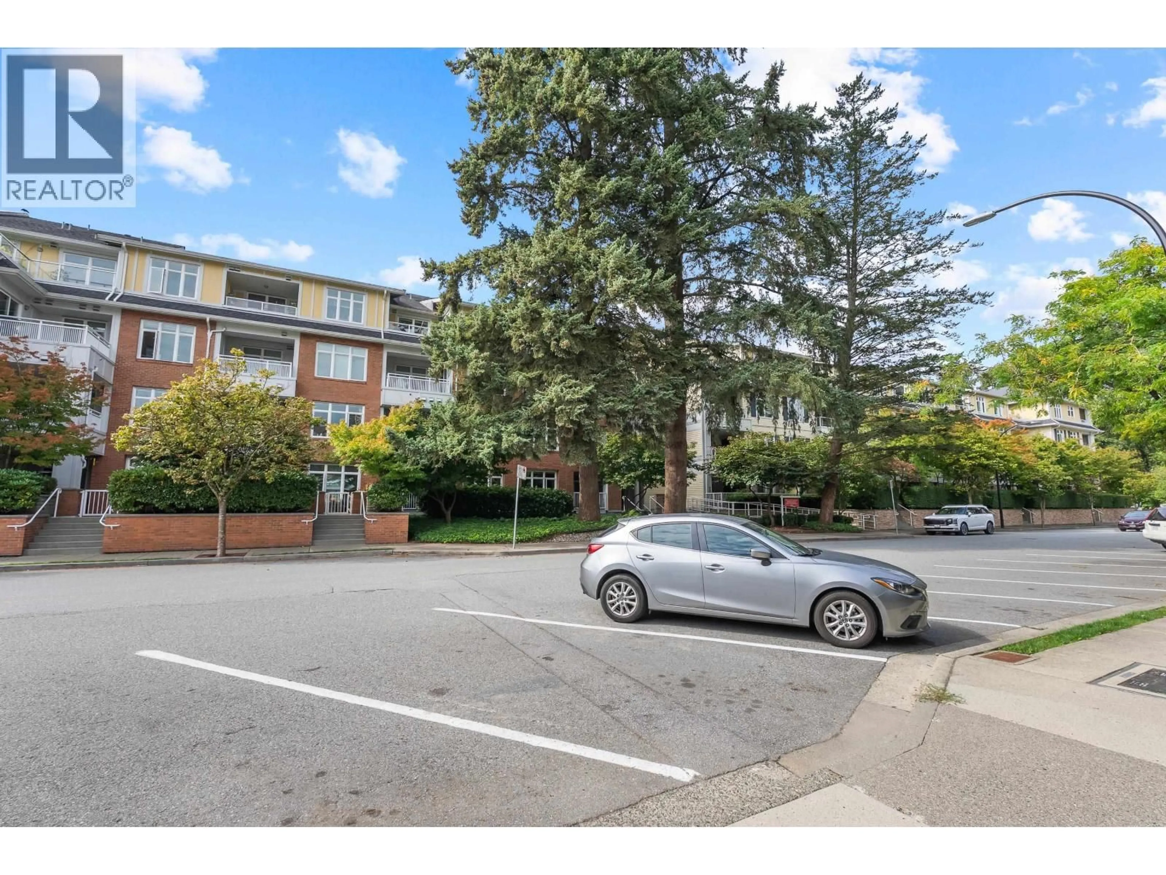 A pic from outside/outdoor area/front of a property/back of a property/a pic from drone, street for 407 - 2368 MARPOLE AVENUE, Port Coquitlam British Columbia V3C2A2