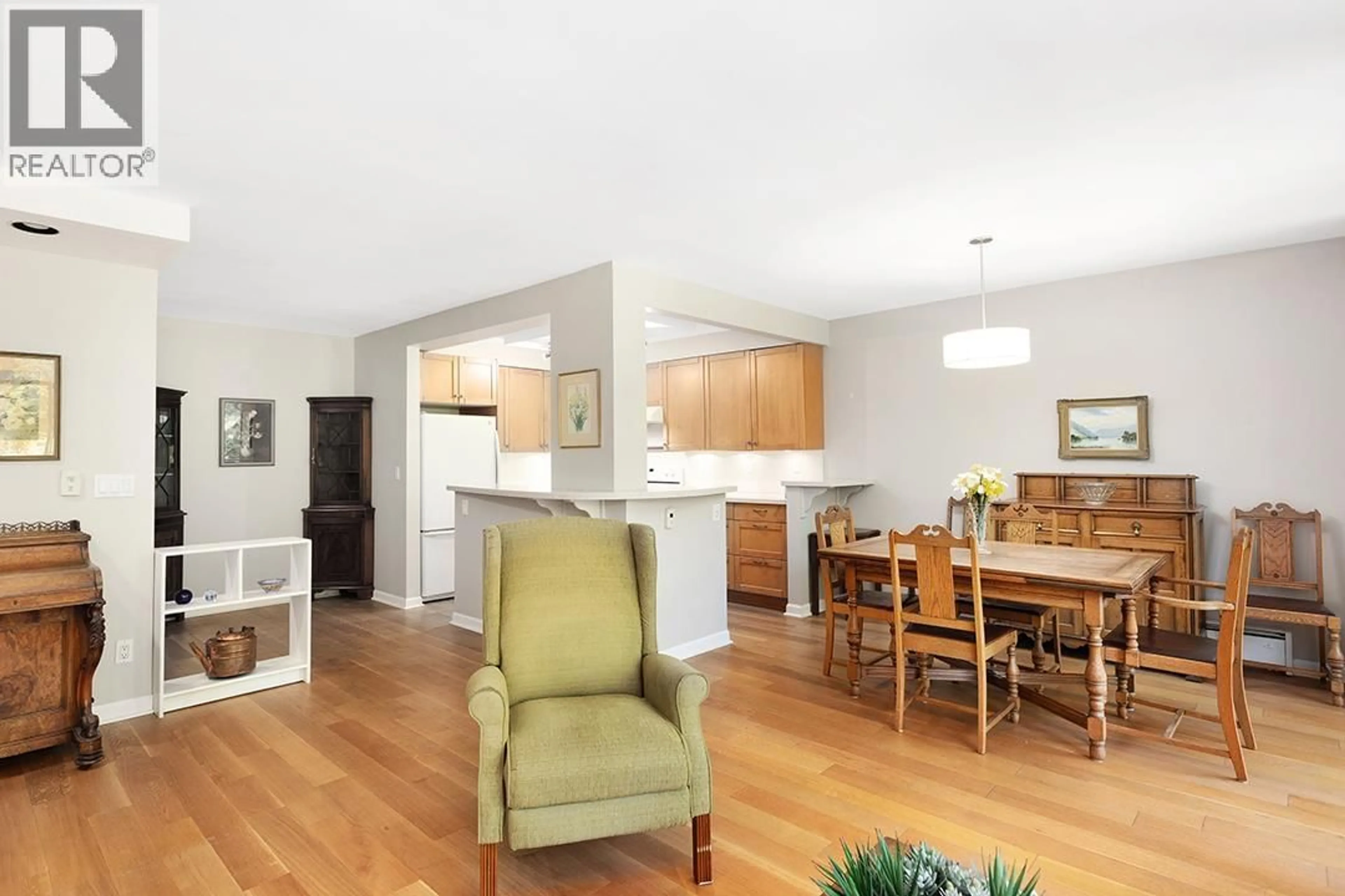 Open concept kitchen, wood/laminate floor for 309 - 4101 YEW STREET, Vancouver British Columbia V6L3B7