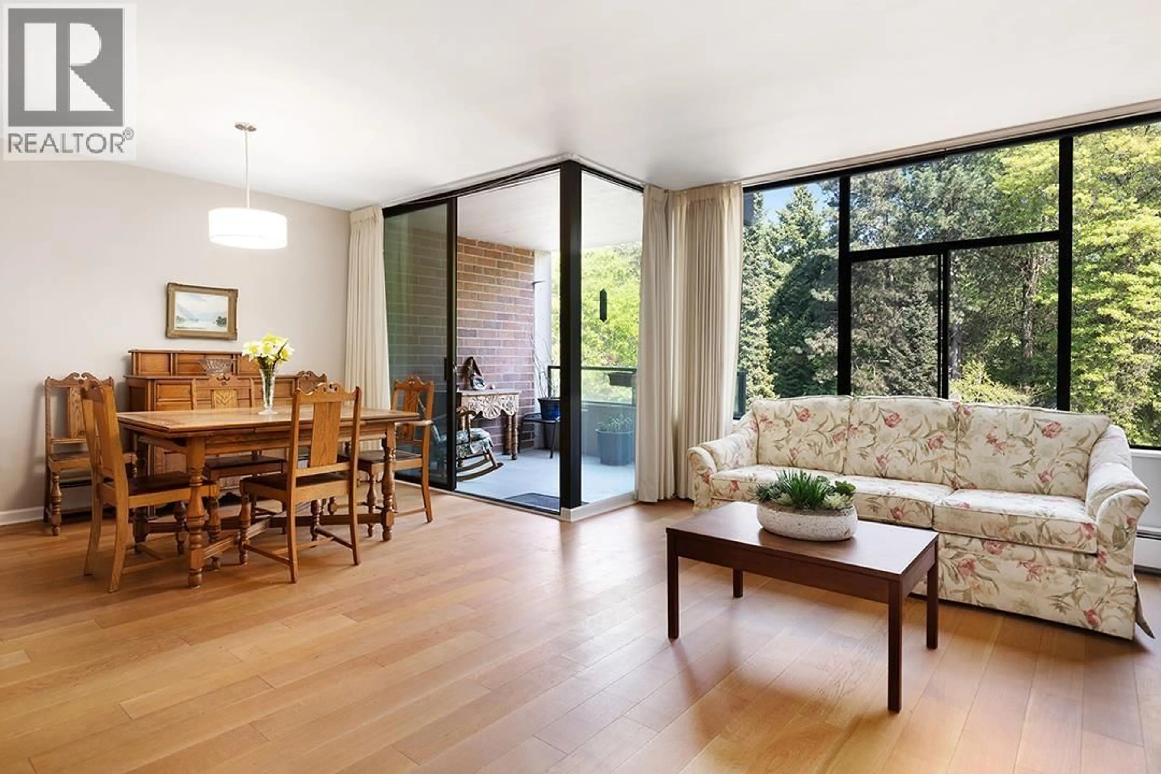 Living room with furniture, wood/laminate floor for 309 - 4101 YEW STREET, Vancouver British Columbia V6L3B7