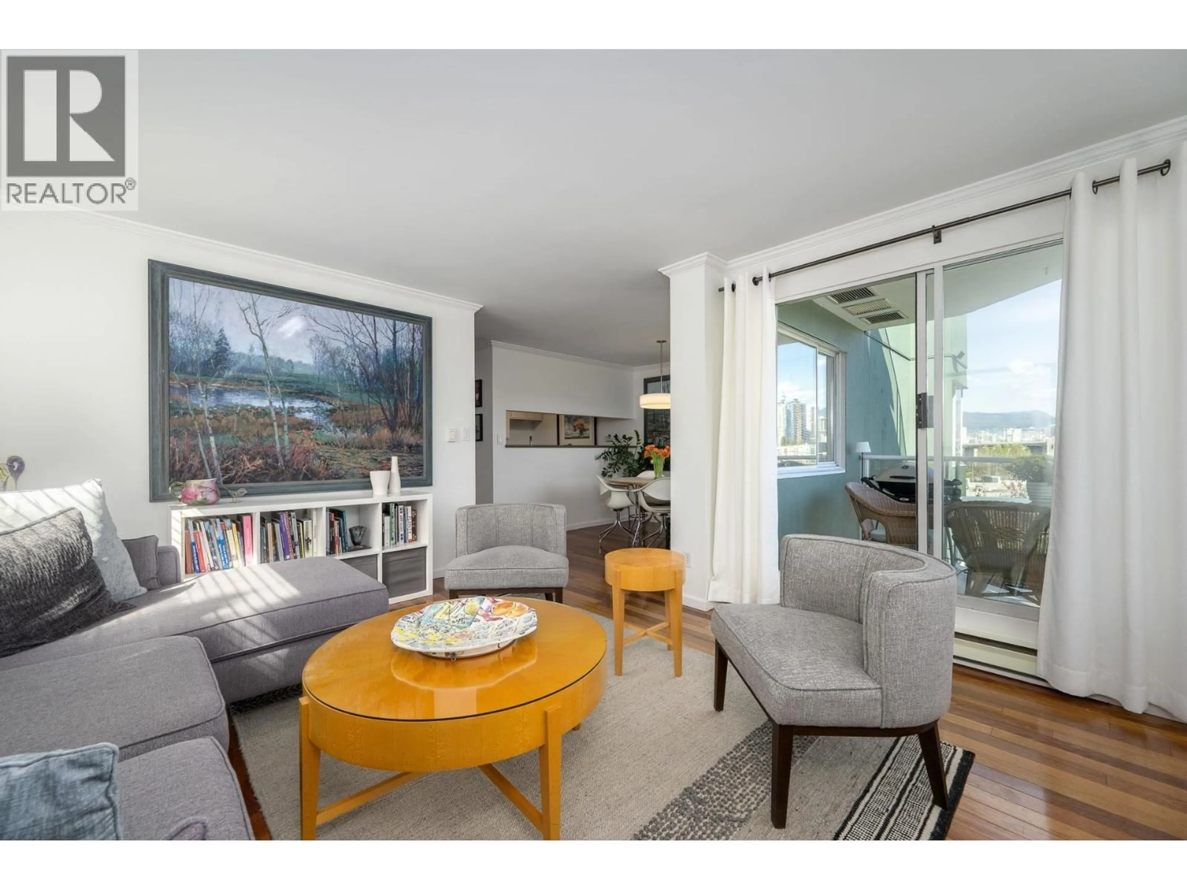 Living room with furniture, wood/laminate floor for 607 - 1508 MARINER WALK, Vancouver British Columbia V6J4X9