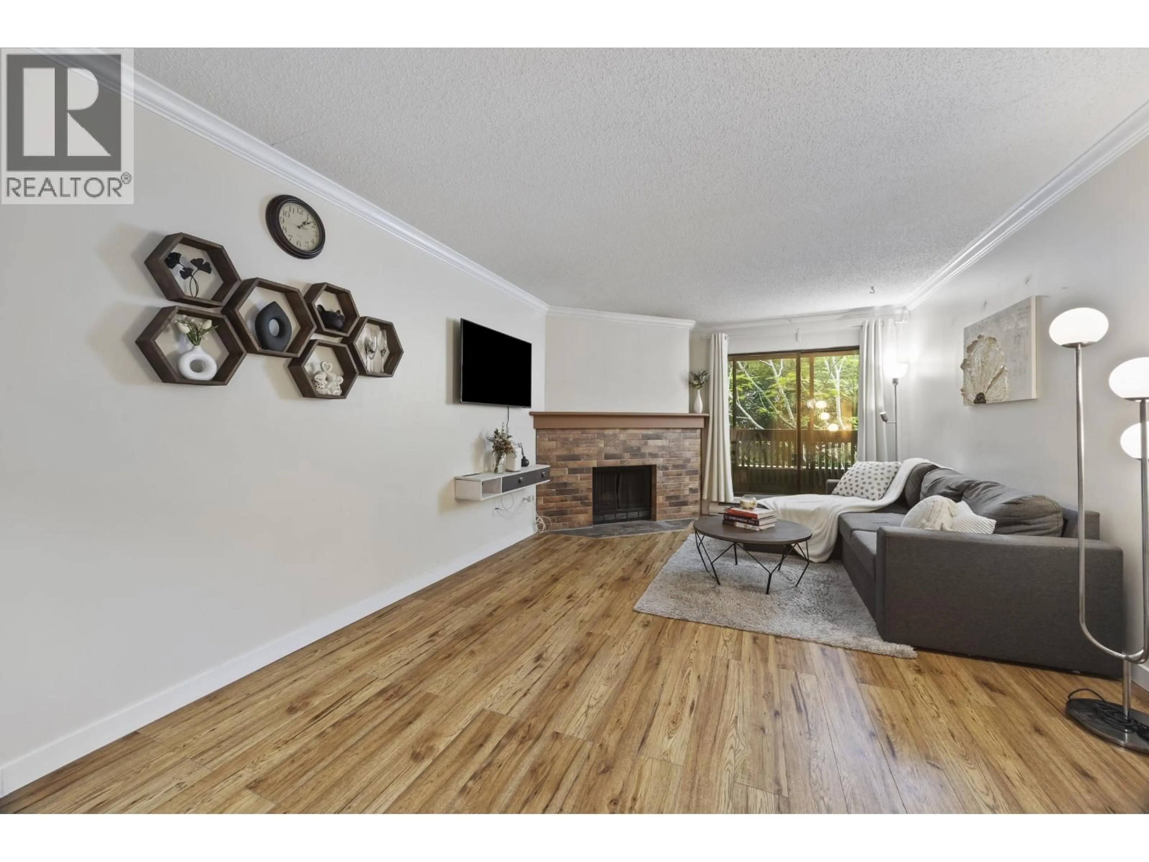 Living room with furniture, wood/laminate floor for 118 - 7431 MINORU BOULEVARD, Richmond British Columbia V6Y1Z3