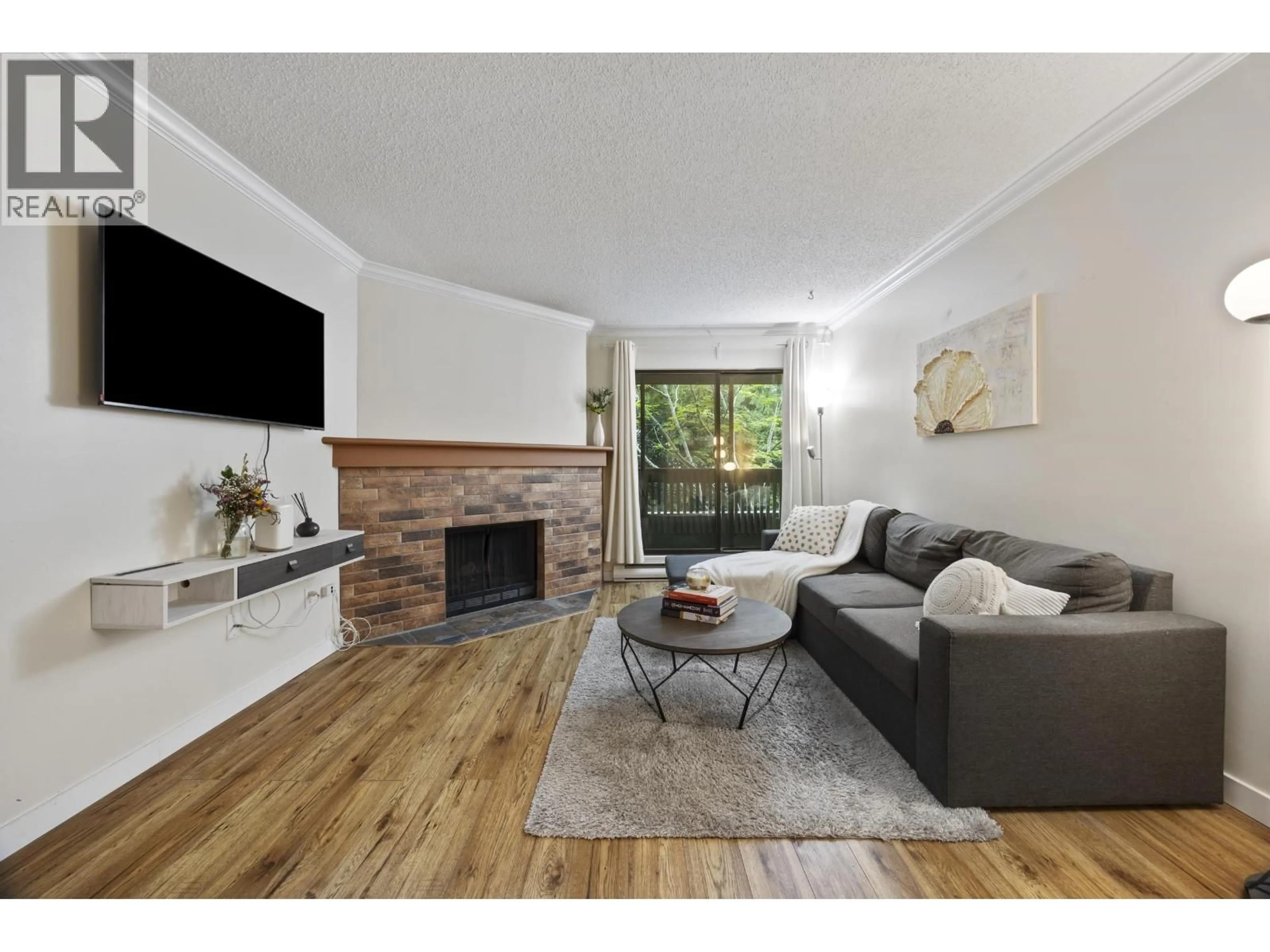 Living room with furniture, wood/laminate floor for 118 - 7431 MINORU BOULEVARD, Richmond British Columbia V6Y1Z3