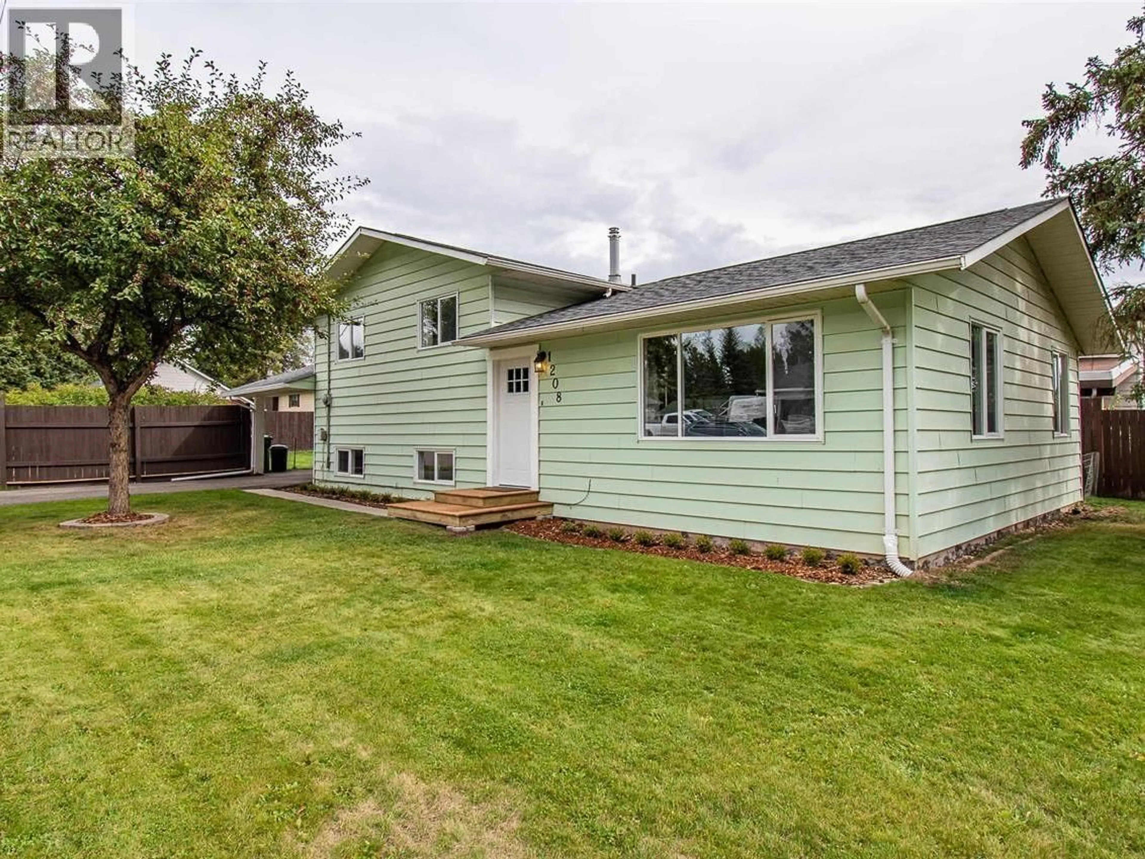 Home with vinyl exterior material, street for 1208 TORONTO STREET, Smithers British Columbia V0J2N0