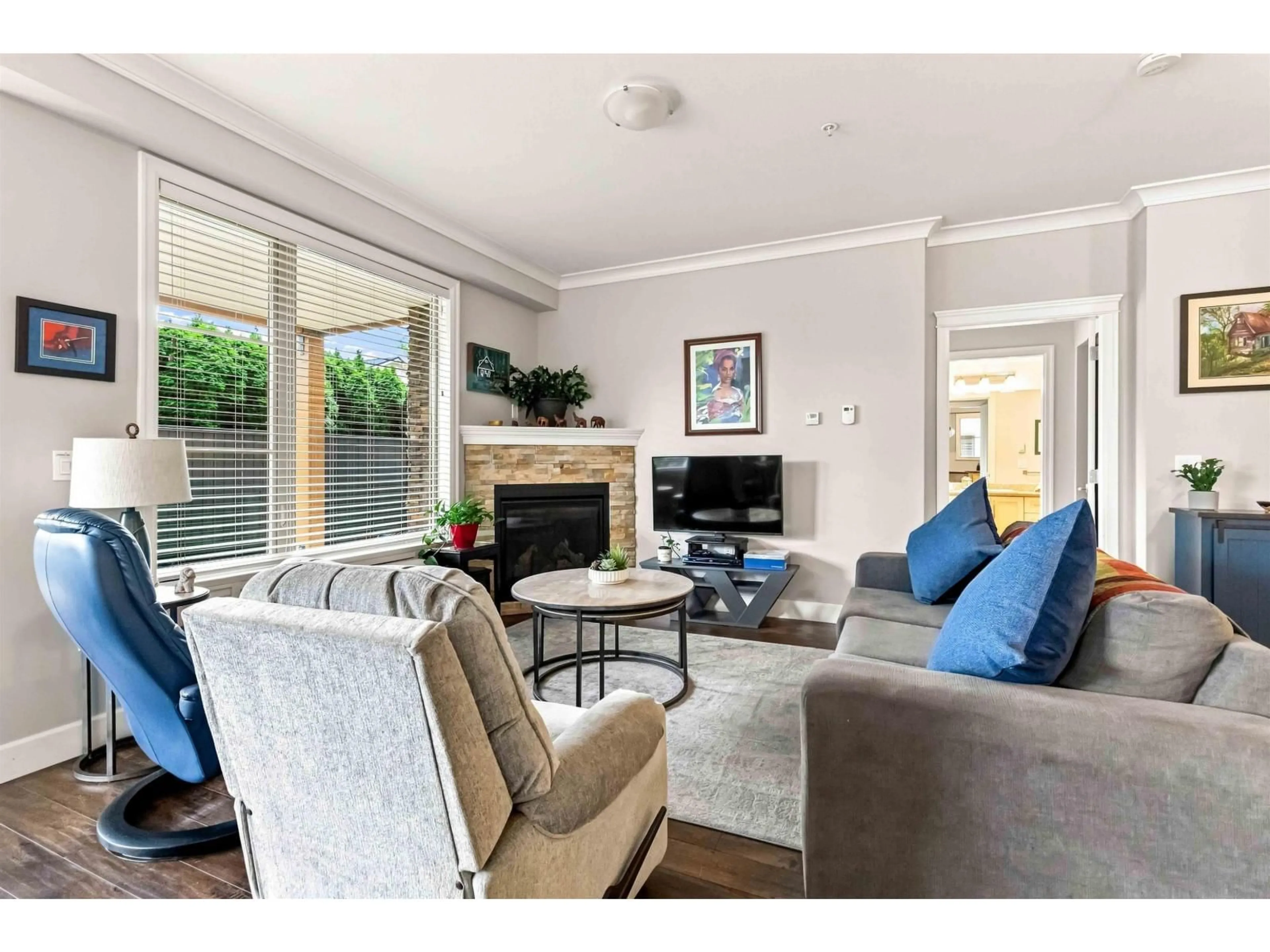 Living room with furniture, wood/laminate floor for 105 - 45746 KEITH WILSON ROAD, Chilliwack British Columbia V2R1J9