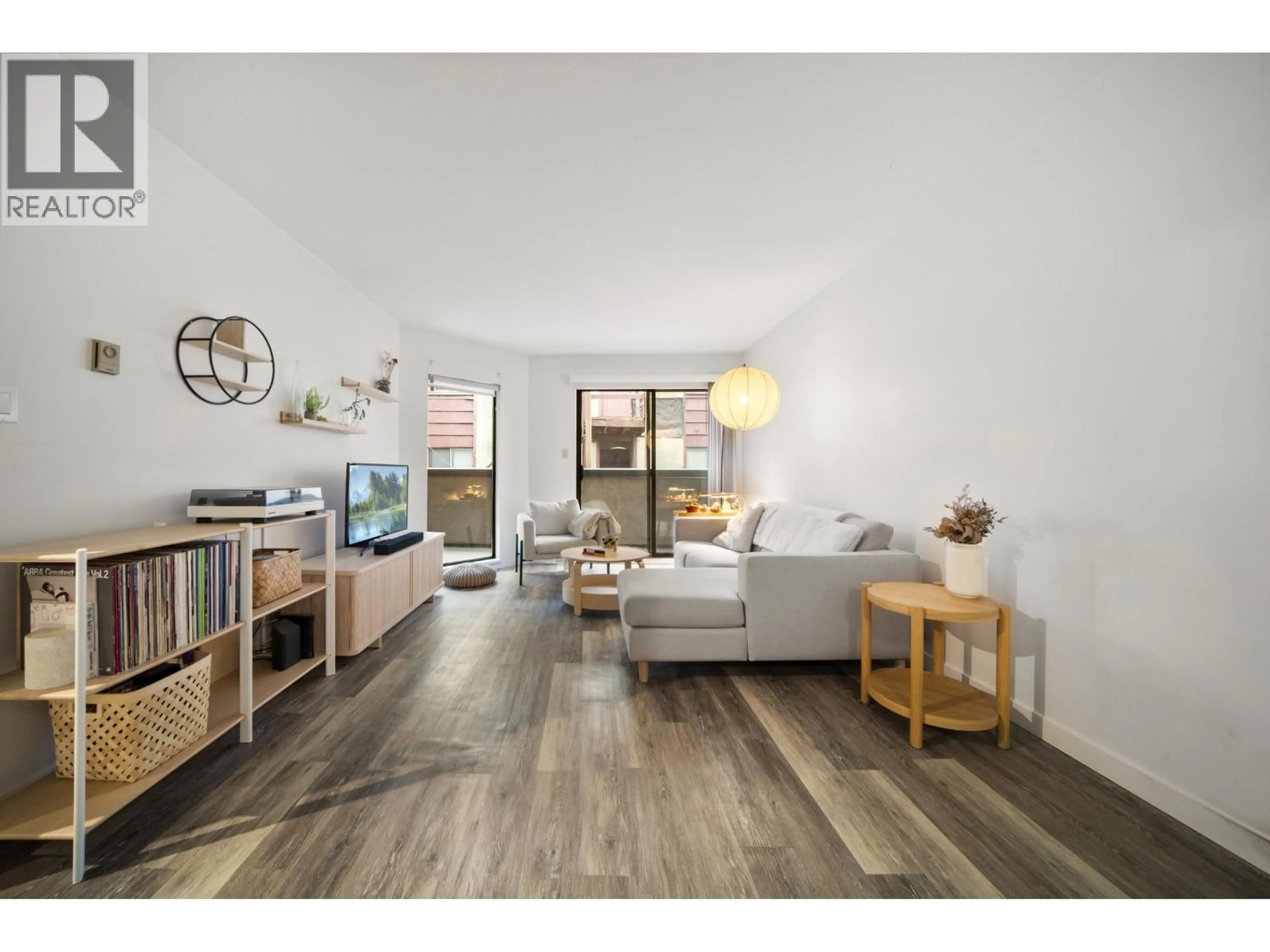 Living room with furniture, wood/laminate floor for 209 - 975 13TH AVENUE, Vancouver British Columbia V5Z1P4
