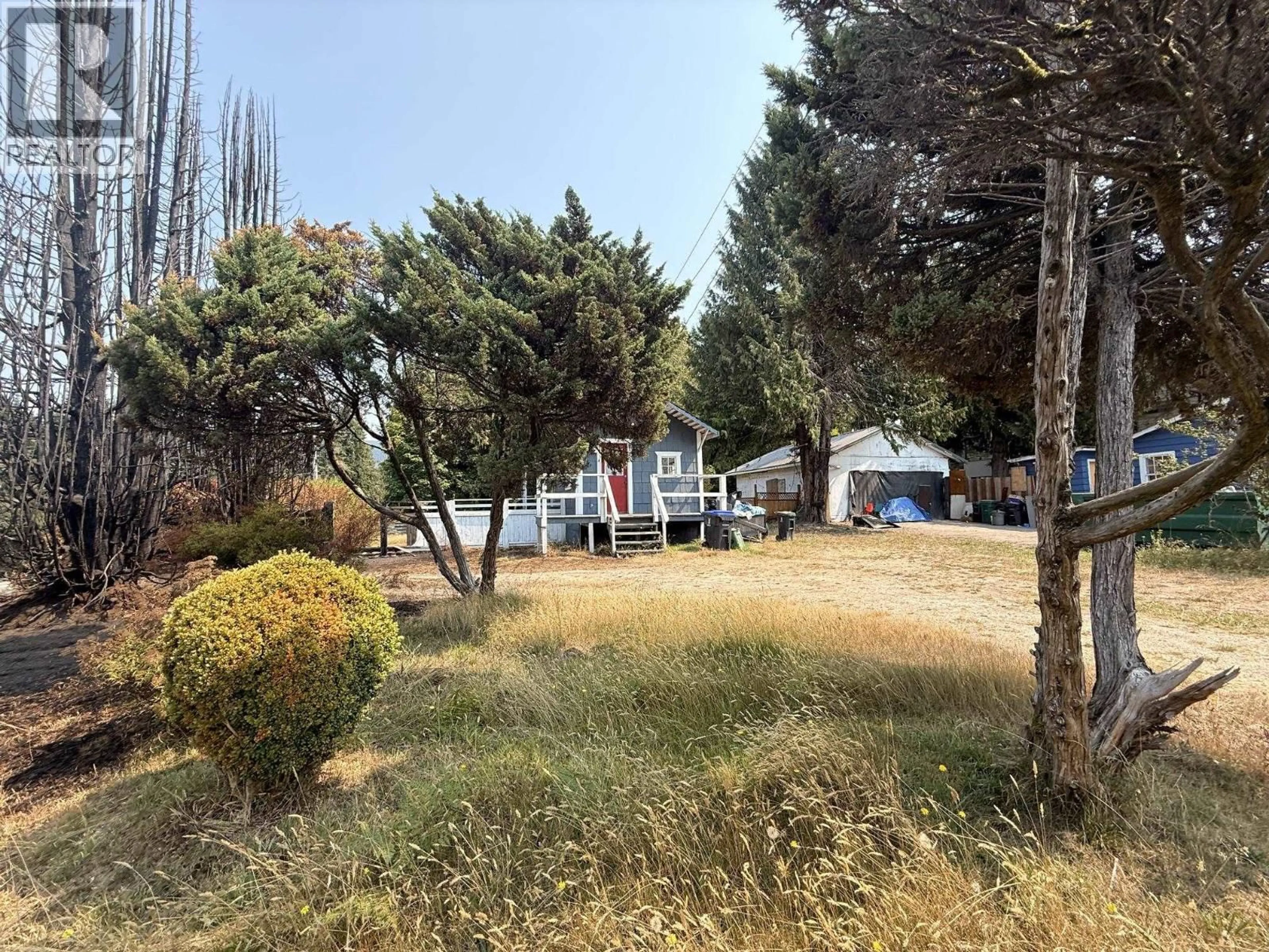 A pic from outside/outdoor area/front of a property/back of a property/a pic from drone, forest/trees view for 5694 WHARF AVENUE, Sechelt British Columbia V0N3A0