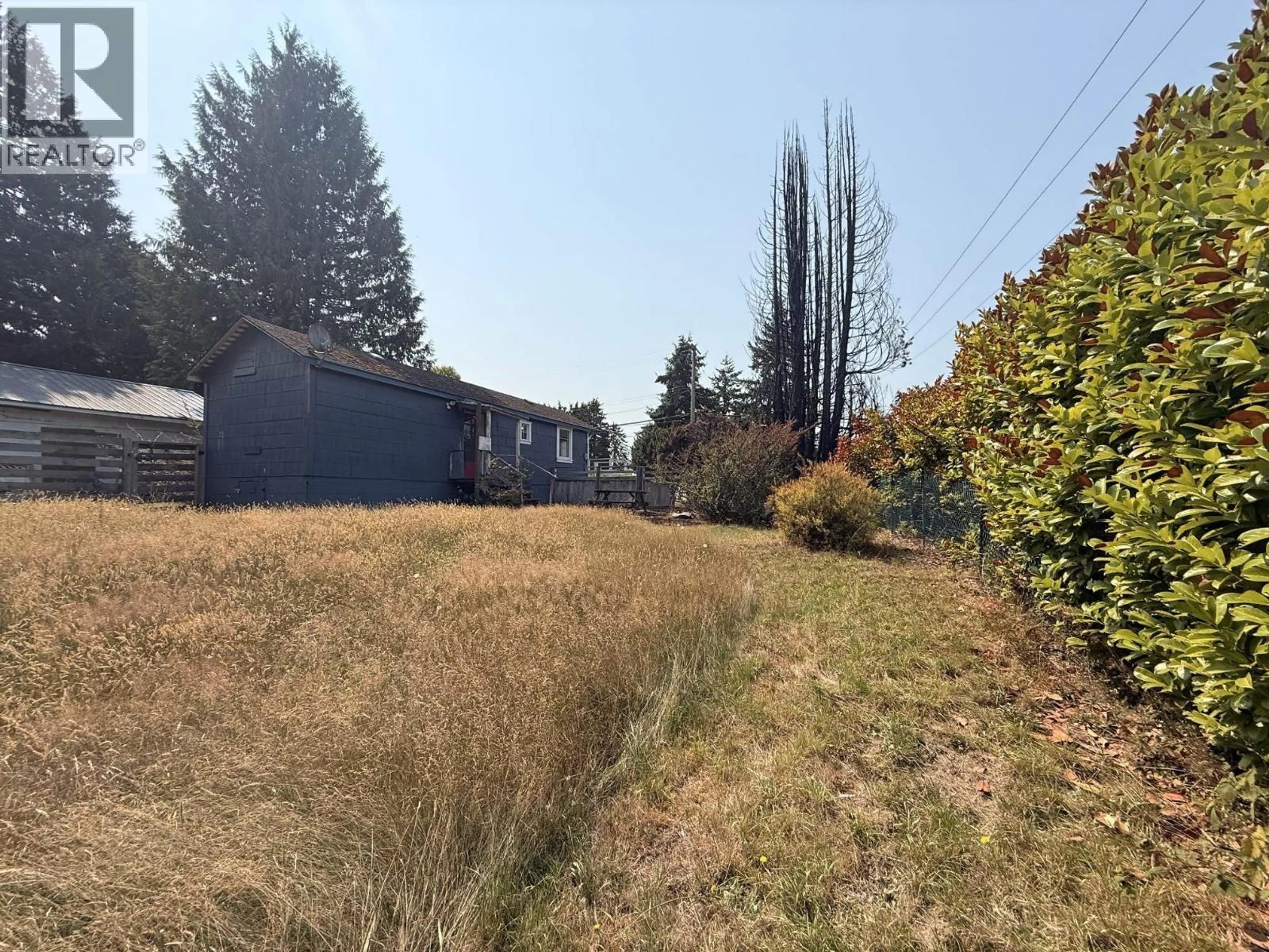 A pic from outside/outdoor area/front of a property/back of a property/a pic from drone, unknown for 5694 WHARF AVENUE, Sechelt British Columbia V0N3A0