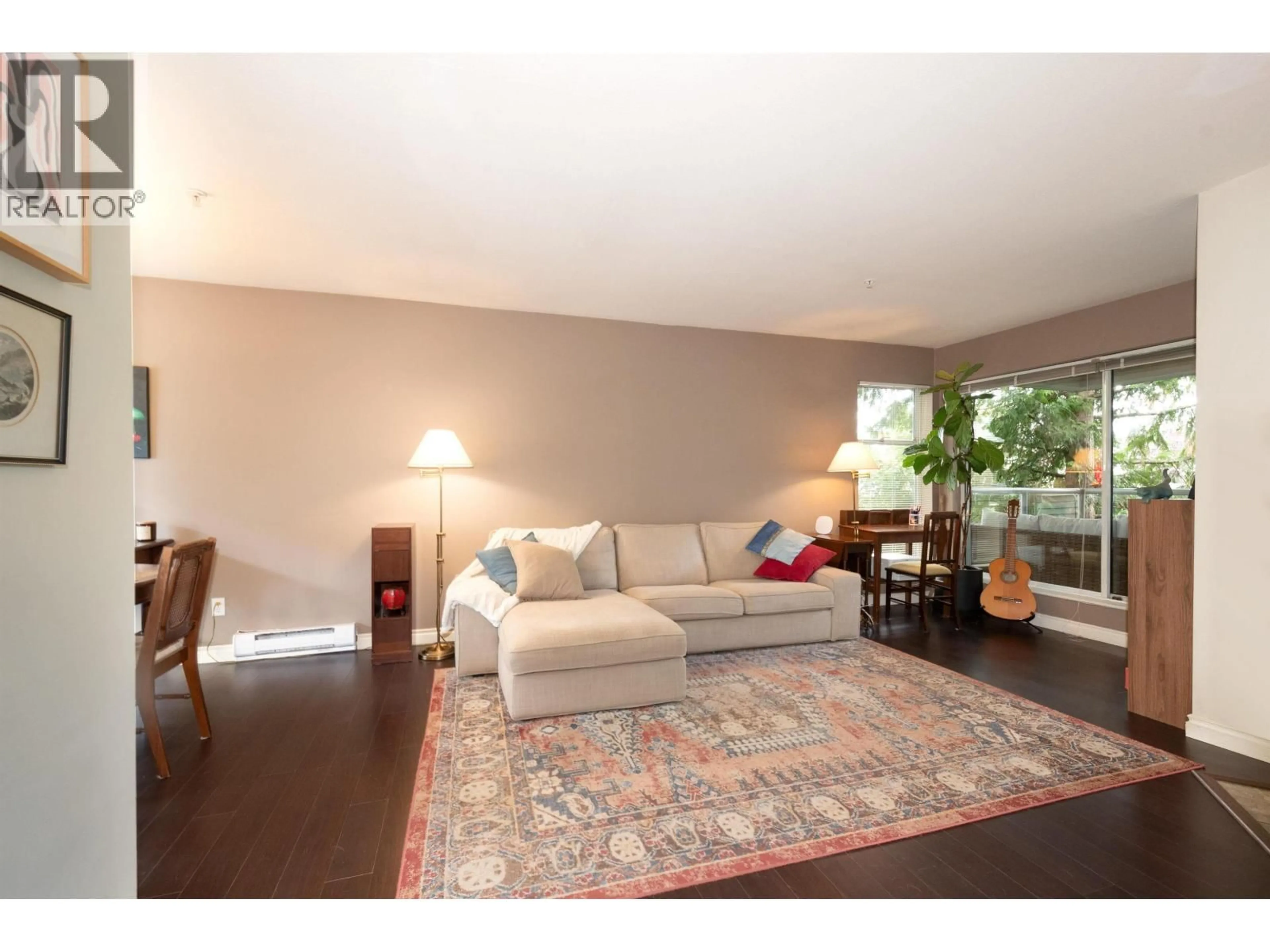 Living room with furniture, wood/laminate floor for 301 - 2250 3RD AVENUE, Vancouver British Columbia V6K1L4