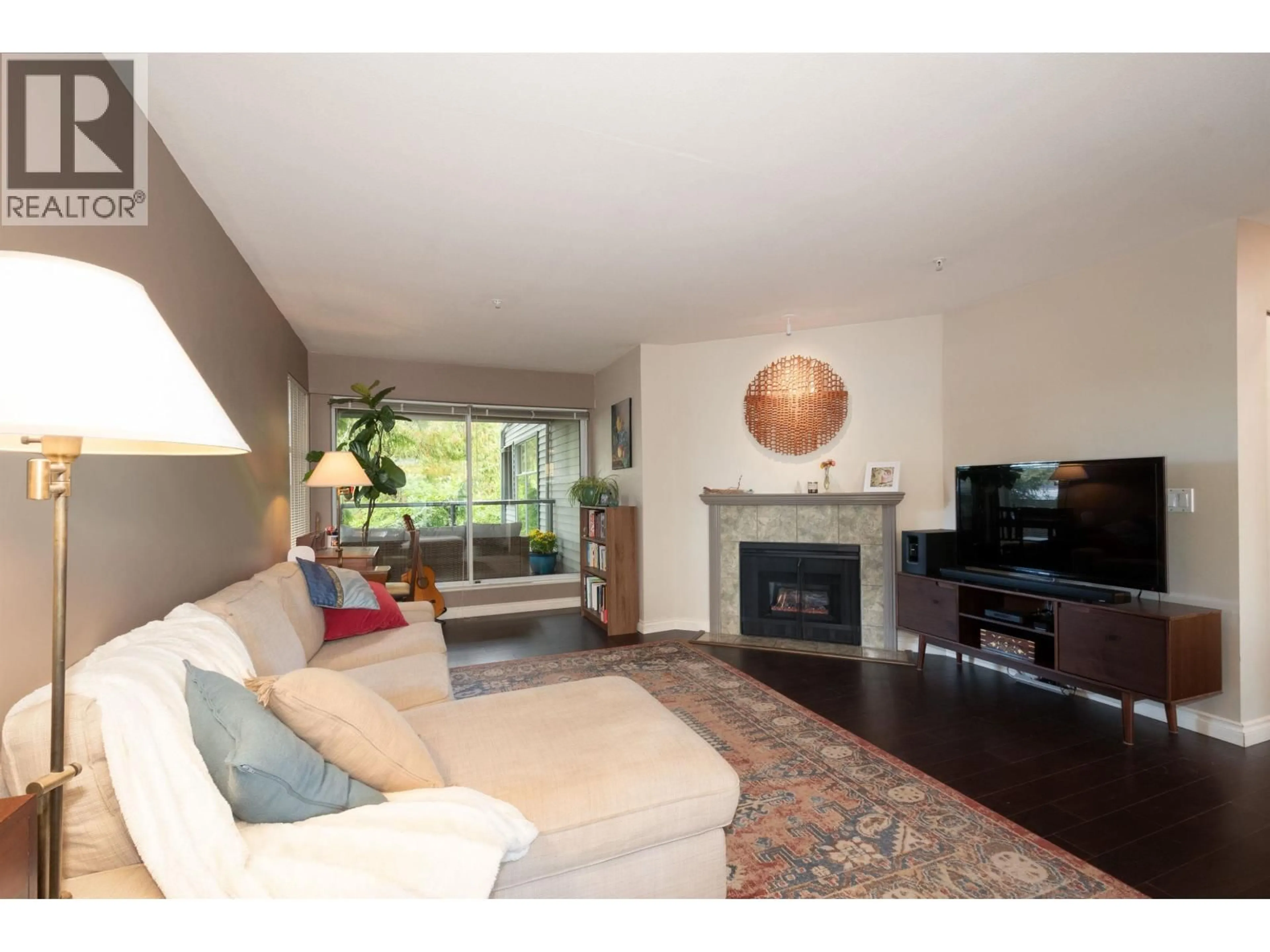 Living room with furniture, wood/laminate floor for 301 - 2250 3RD AVENUE, Vancouver British Columbia V6K1L4