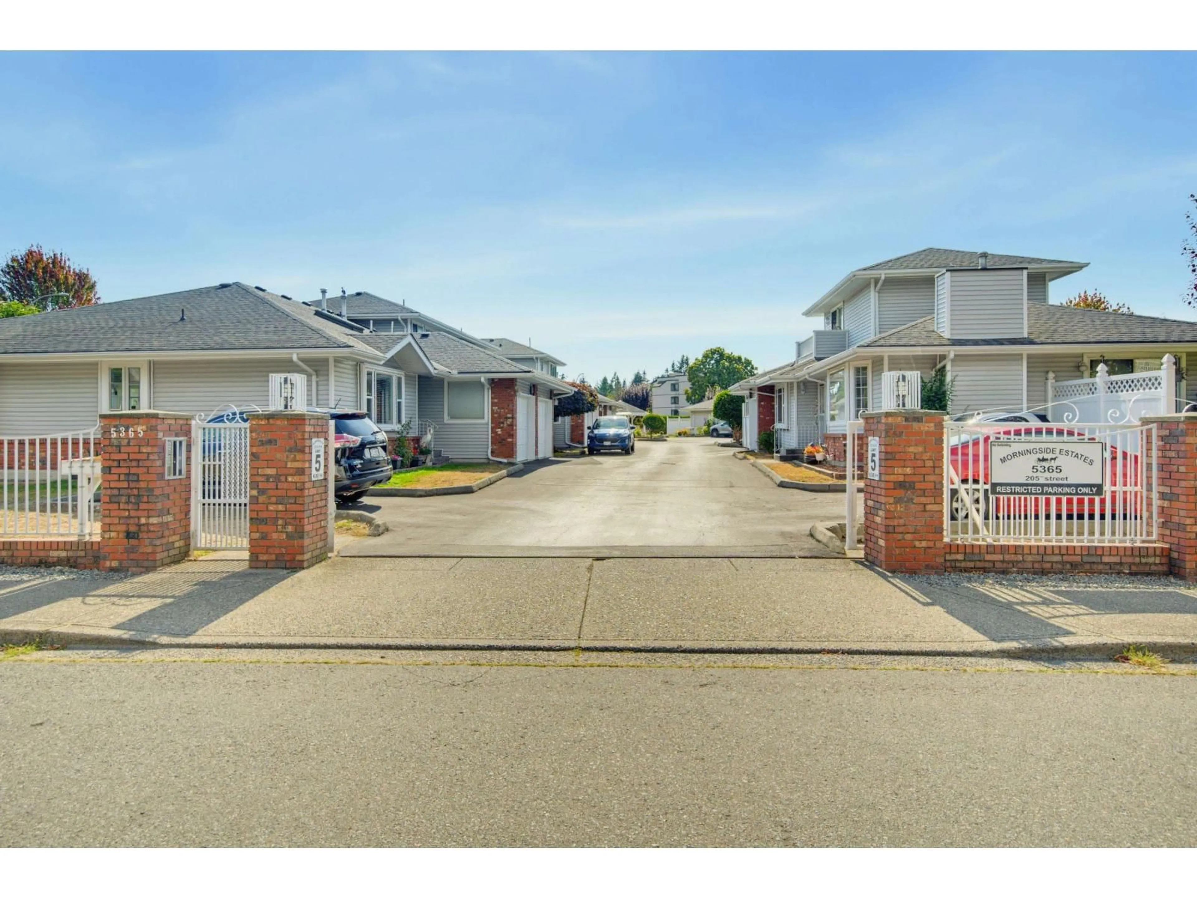 A pic from outside/outdoor area/front of a property/back of a property/a pic from drone, street for 11 - 5365 205 STREET, Langley British Columbia V3A7V7