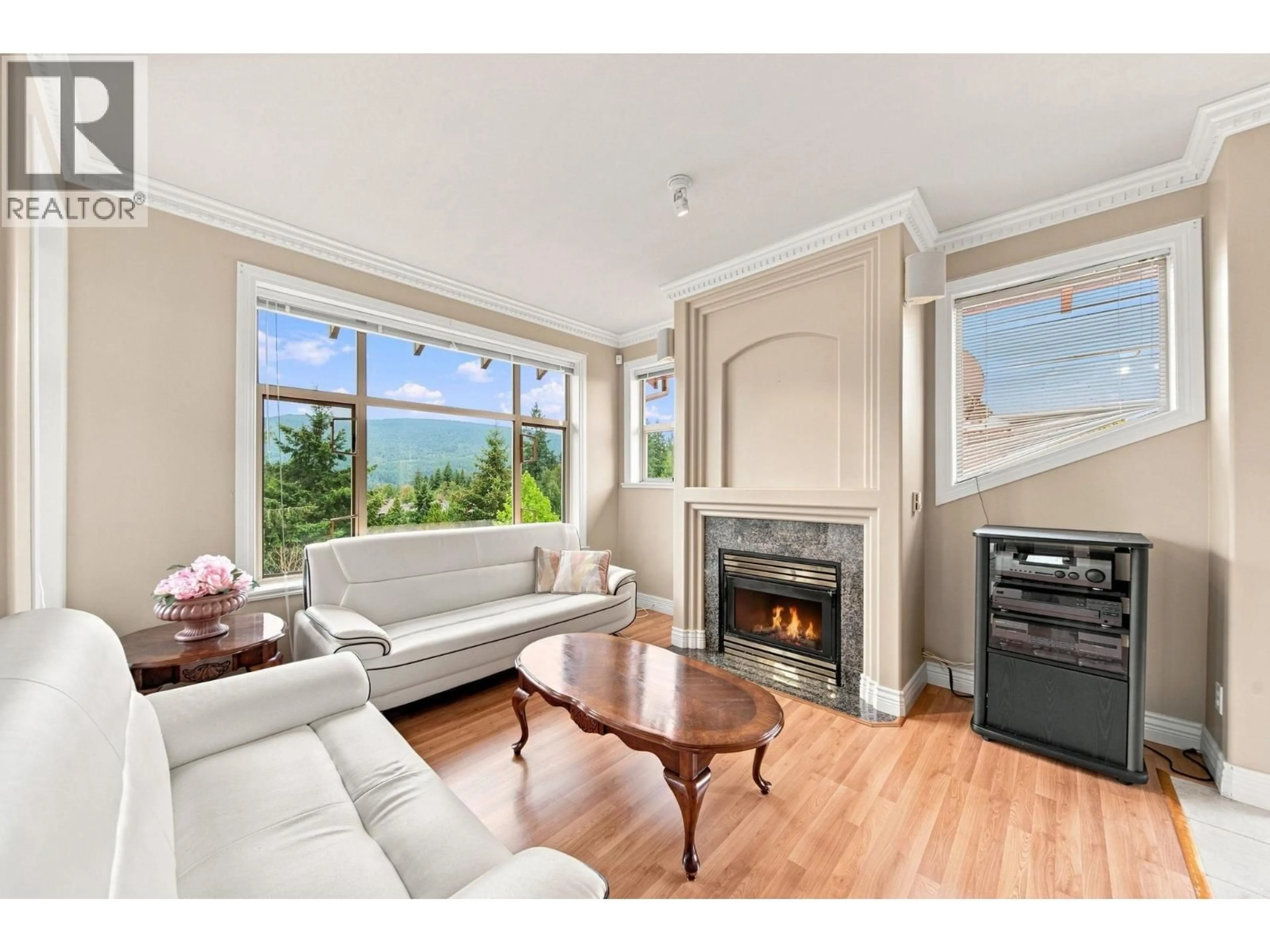 Living room with furniture, wood/laminate floor for 302 - 3176 PLATEAU BOULEVARD, Coquitlam British Columbia V3E3J2