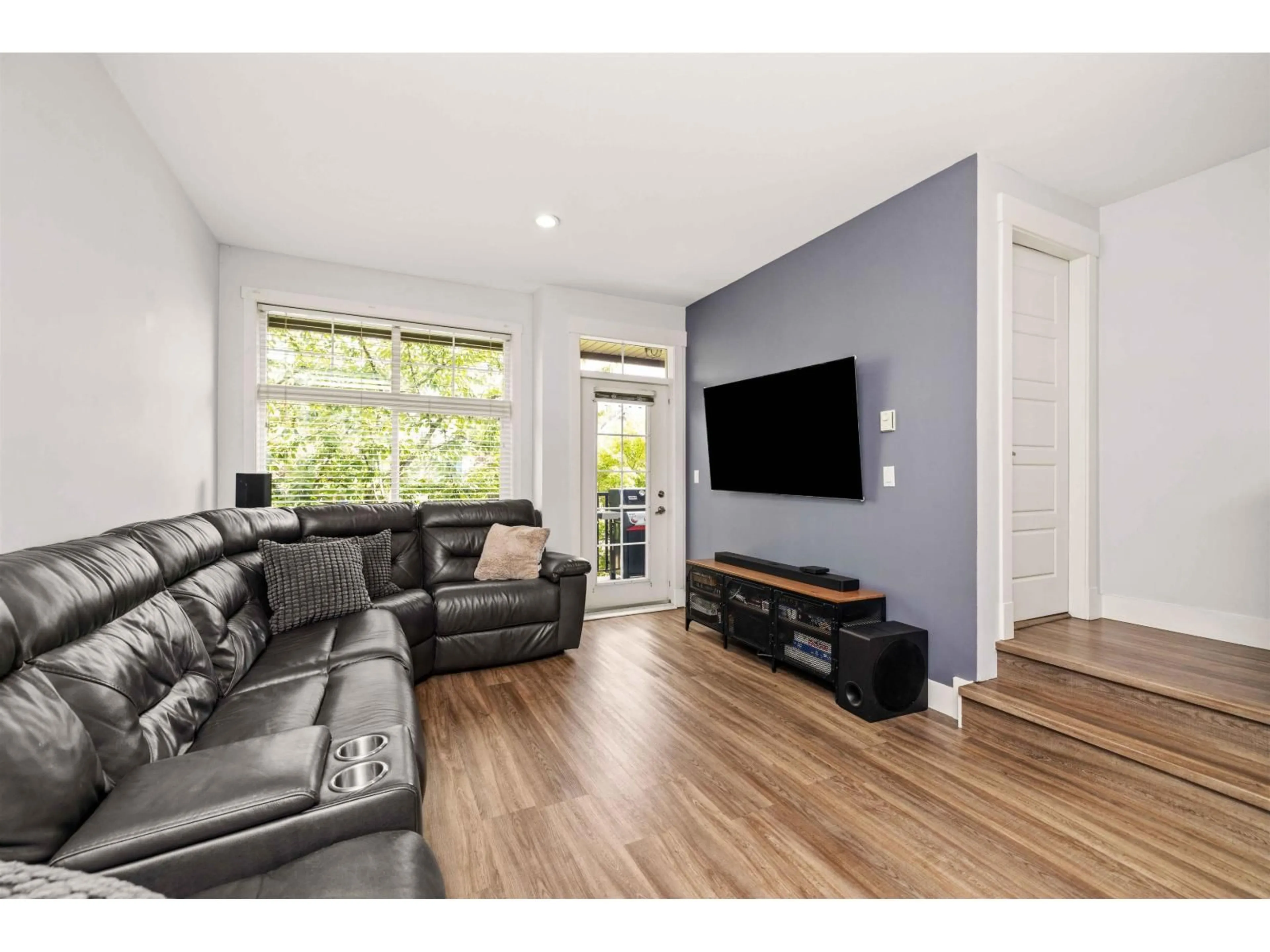 Living room with furniture, wood/laminate floor for 24 - 7332 194A STREET, Surrey British Columbia V4N6K9