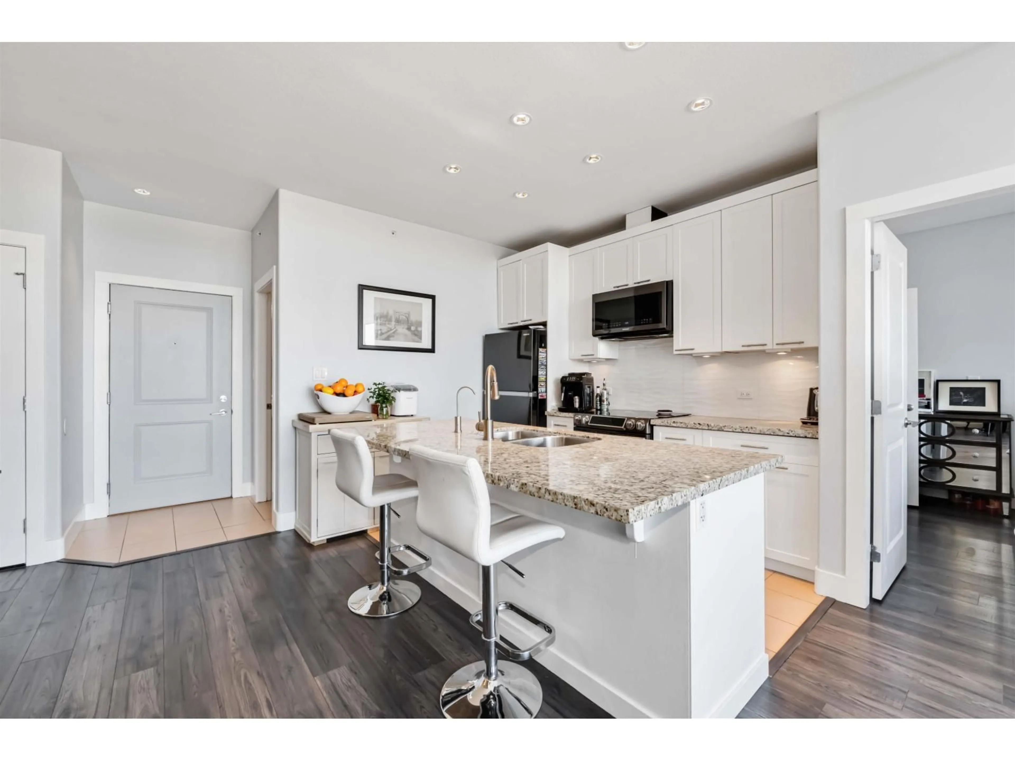 Open concept kitchen, wood/laminate floor for 421 - 2970 KING GEORGE BOULEVARD, Surrey British Columbia V4P0E6