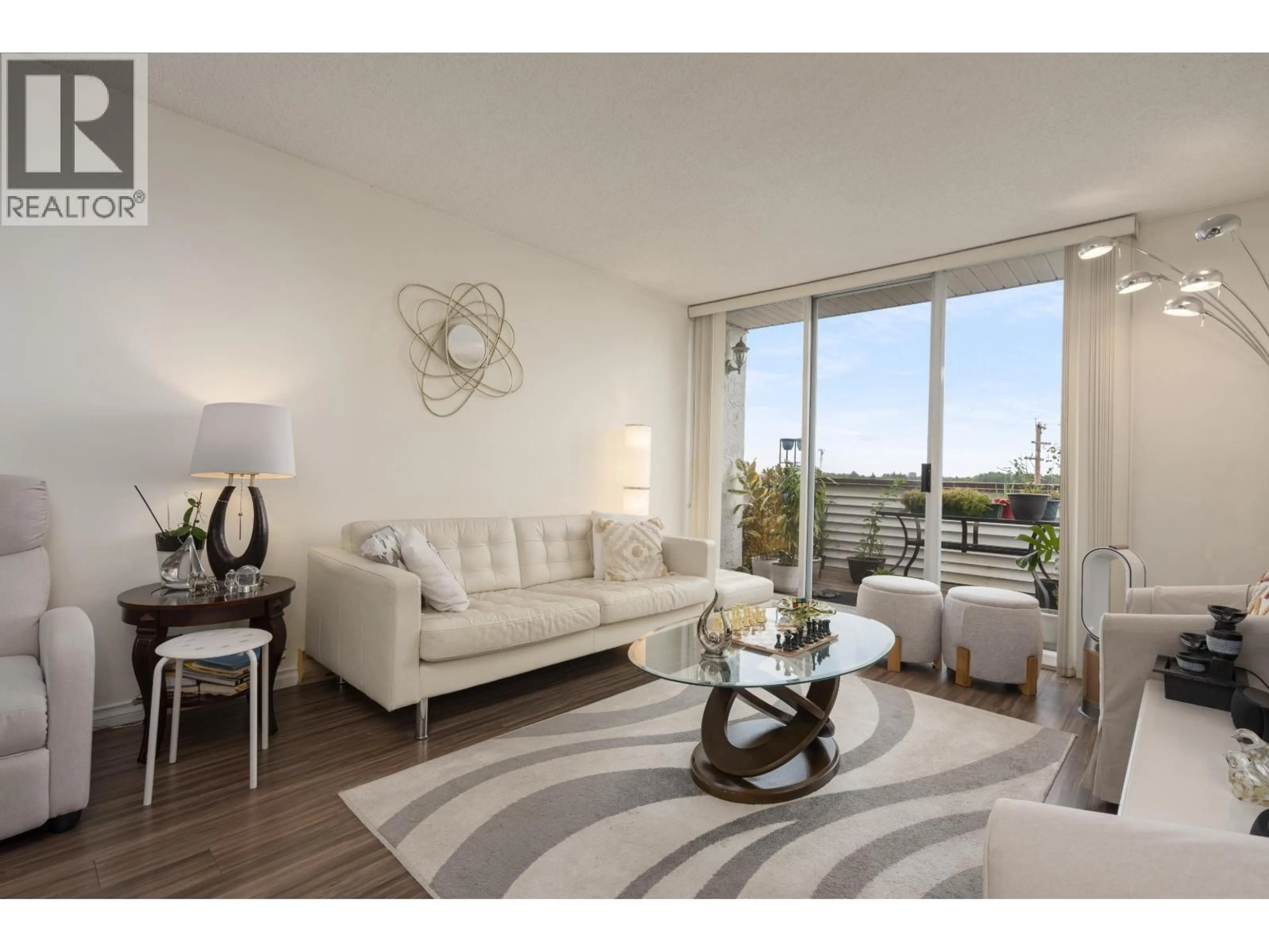 Living room with furniture, wood/laminate floor for 304 - 9151 NO. 5 ROAD, Richmond British Columbia V7A4T9