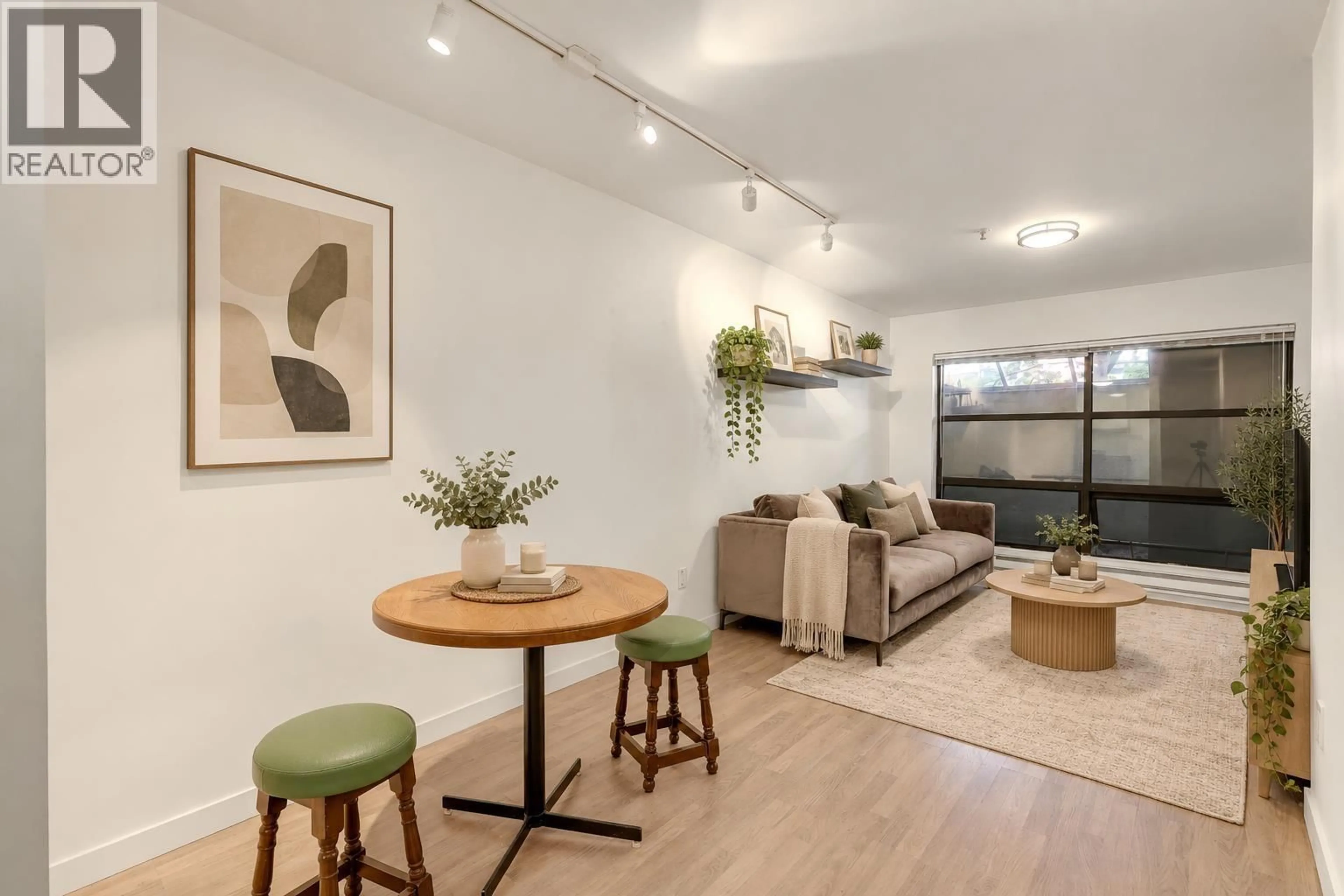 Living room with furniture, wood/laminate floor for 208 - 1106 PACIFIC ST STREET, Vancouver British Columbia V6E1T4