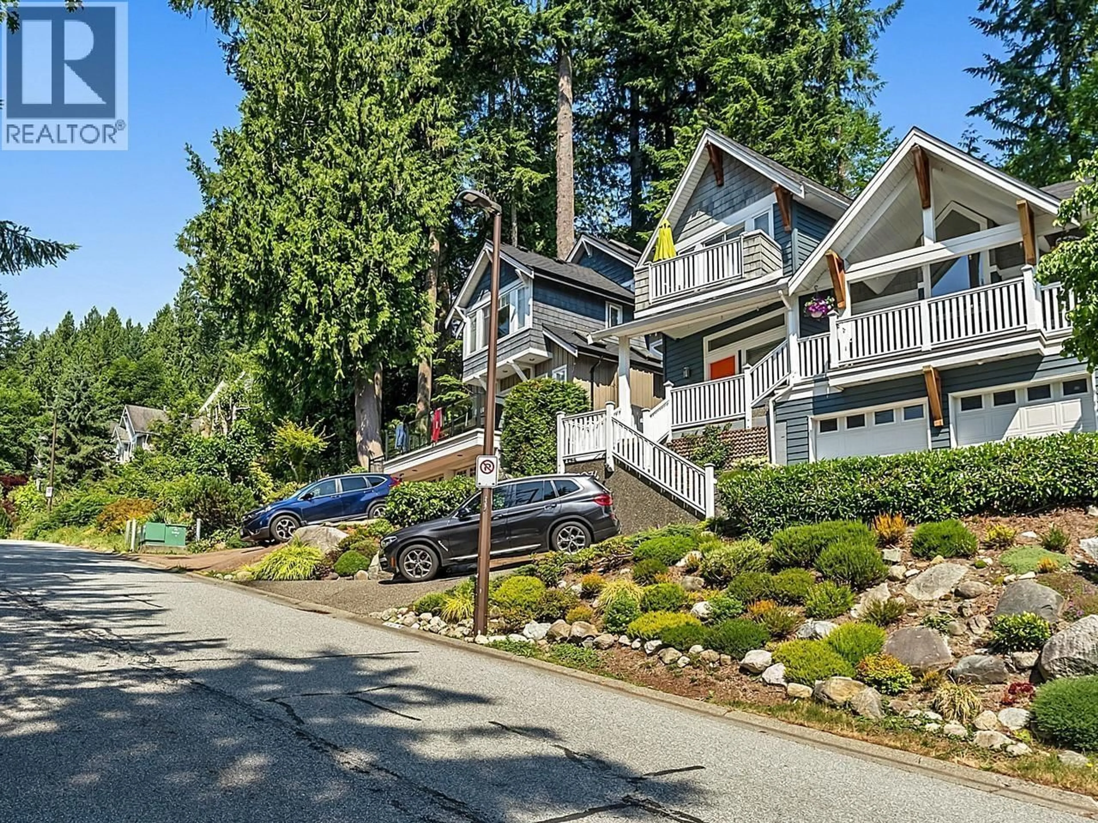 A pic from outside/outdoor area/front of a property/back of a property/a pic from drone, street for 1074 KILMER ROAD, North Vancouver British Columbia V7K1R1